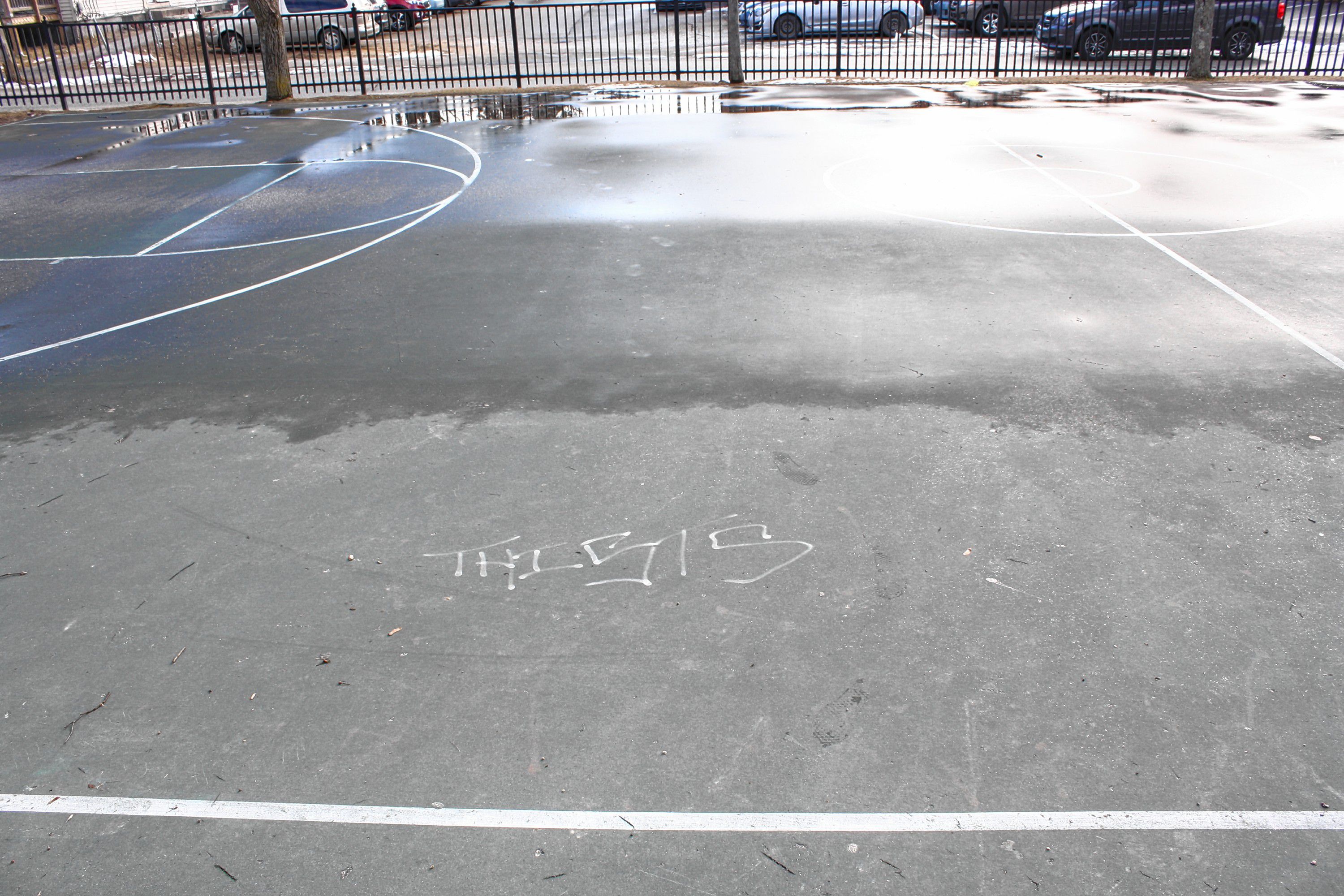 This small park is used mostly for basketball, and it gets quite a bit of use when the weather is nicer. Maybe you recognize this bit of graffiti on the court, or that black rail fencing you see in the background. JON BODELL / Insider staff