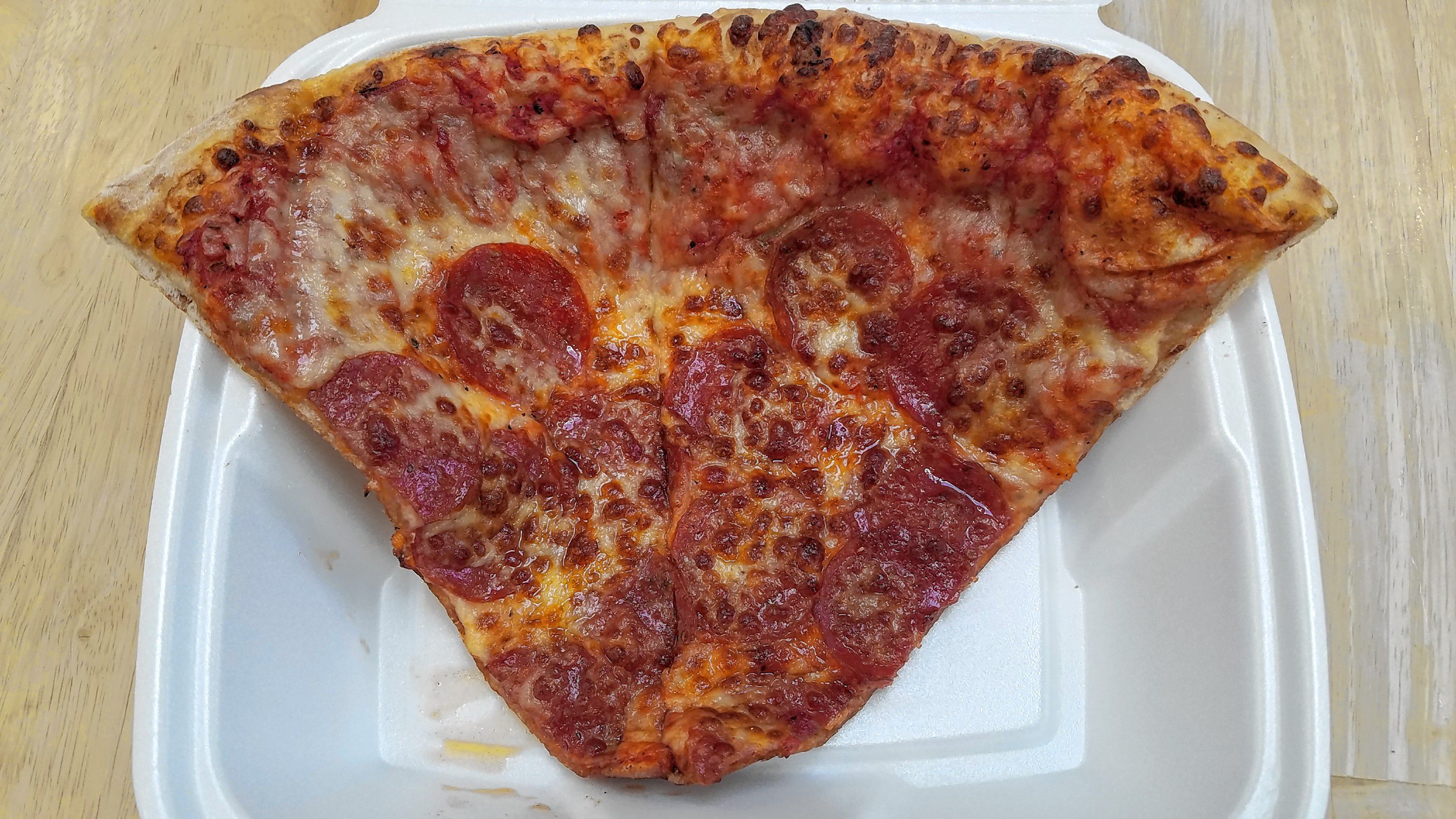 A double-wide slice of pepperoni from Checkmate Pizza. JON BODELL / Insider staff