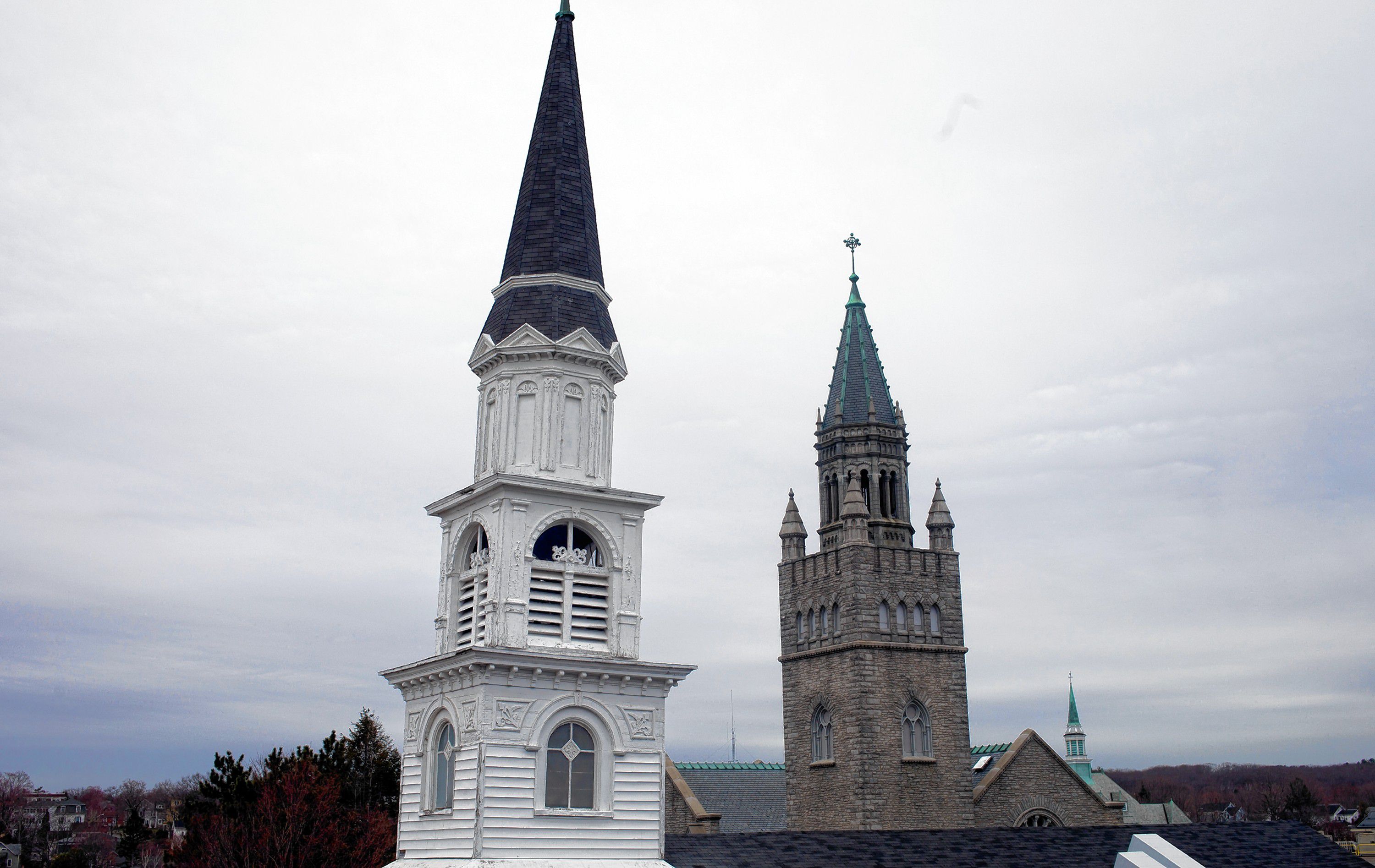 The steeples from Centerpoint Baptist Church (left) and The First Church of Christ, Scientist in downtown Concord on Thursday evening, April 19, 2019.