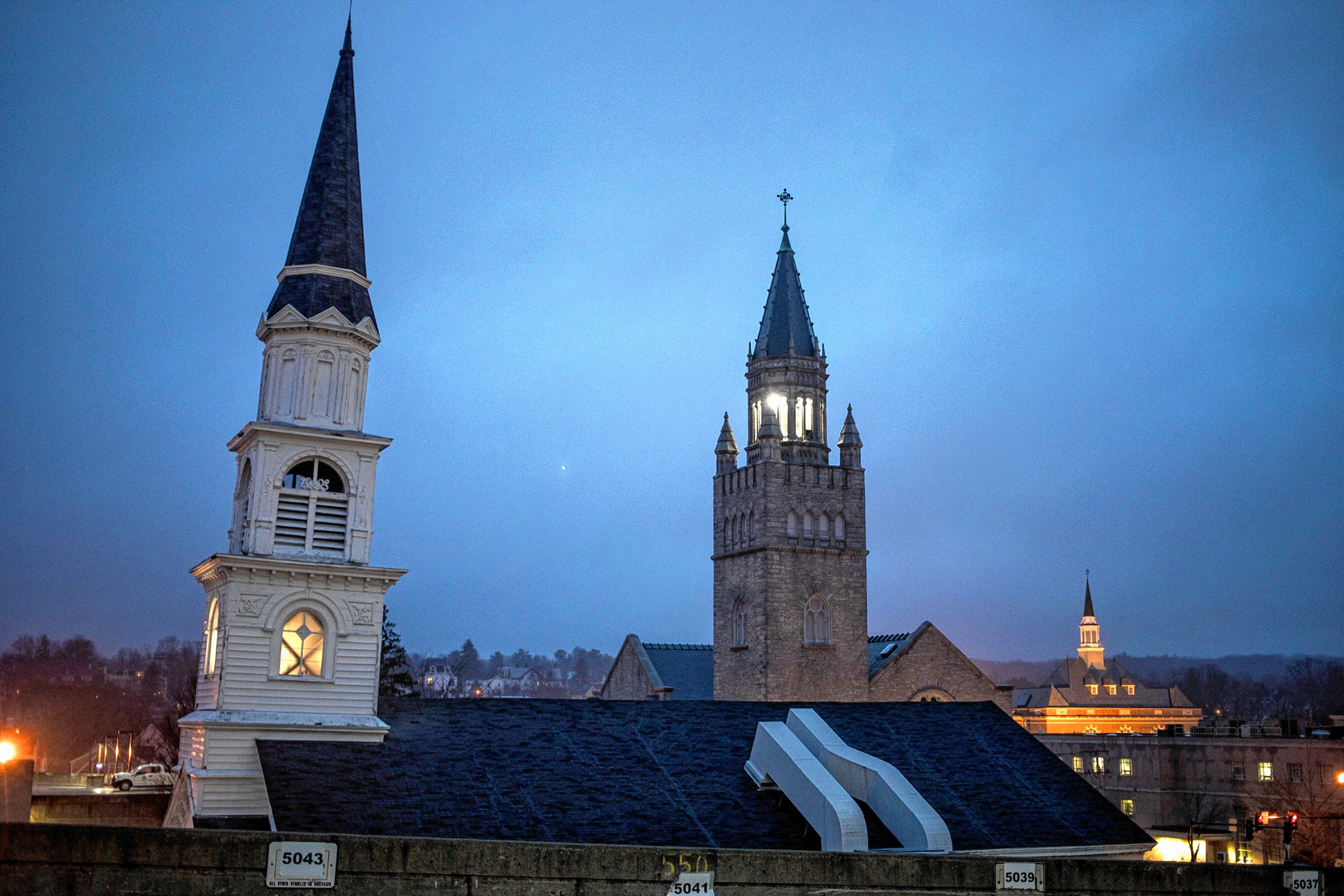 The steeples from Centerpoint Baptist Church (left) and The First Church of Christ, Scientist in downtown Concord on Thursday evening, April 19, 2019.