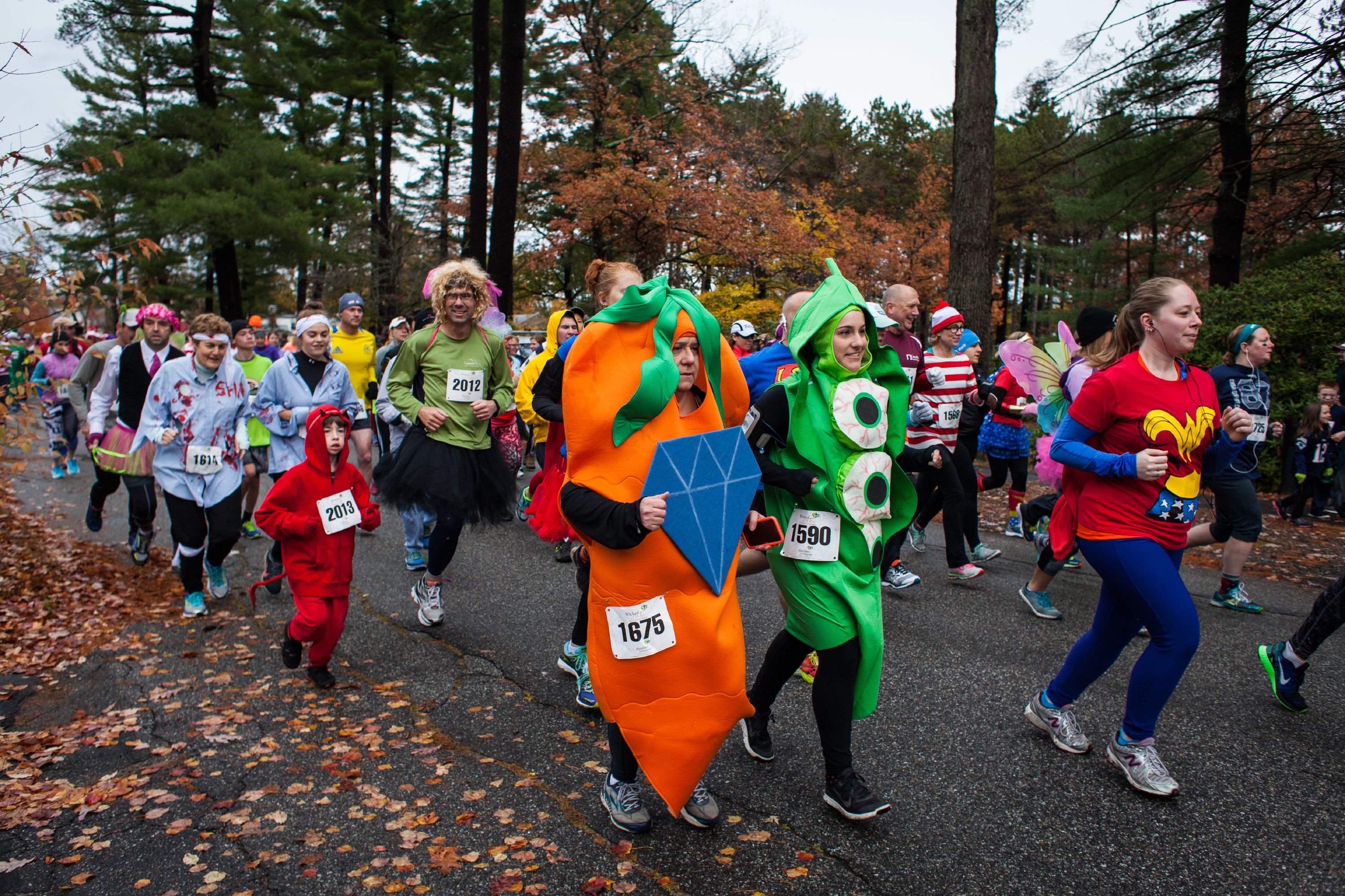 Runners leave the starting line of the Wicked FIT 5K race at Rollins ...