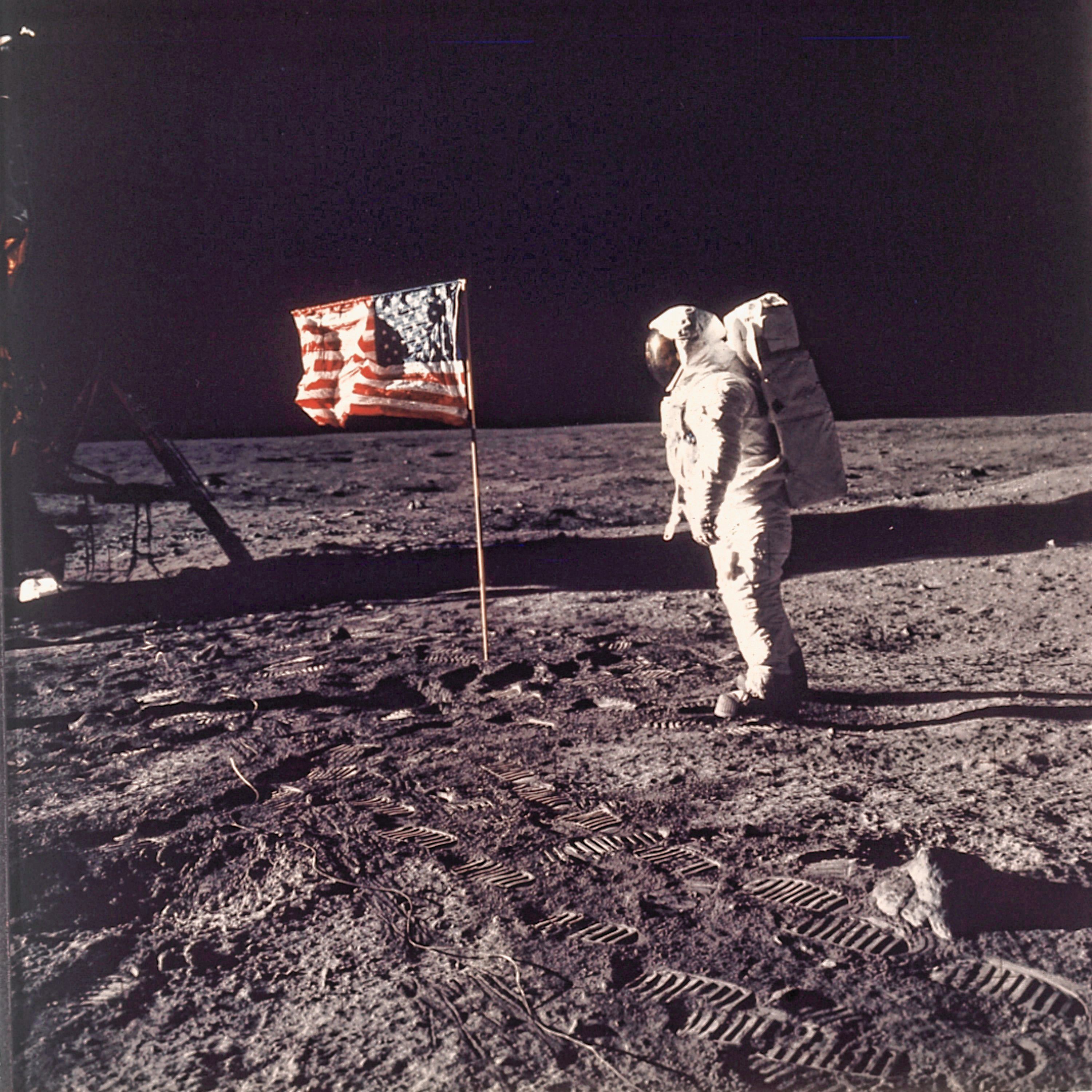 Astronaut Edwin E Buzz Aldrin Jr Poses For A Photograph Beside The U S Flag Deployed On The