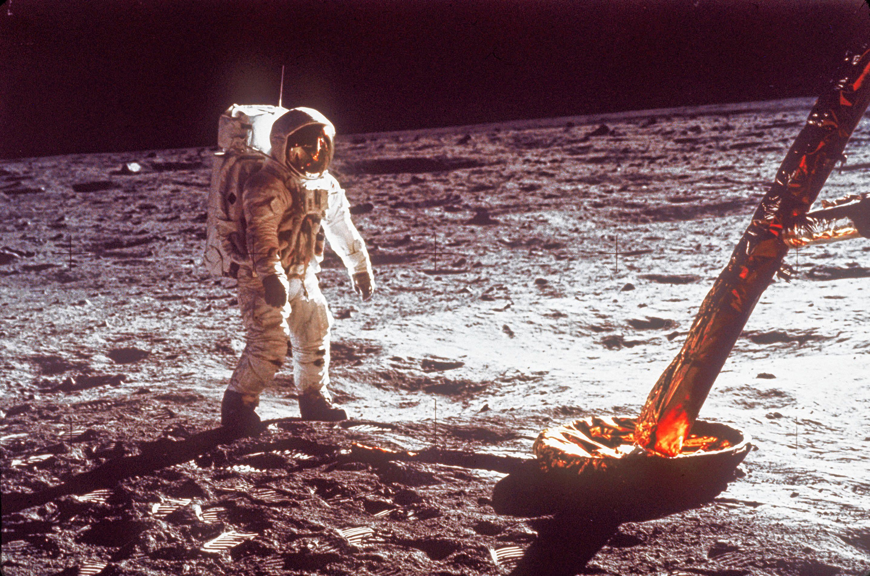 In this July  1969 file photo,  astronaut Buzz Aldrin walks by the footpad of the Apollo 11 Lunar Module. NASA