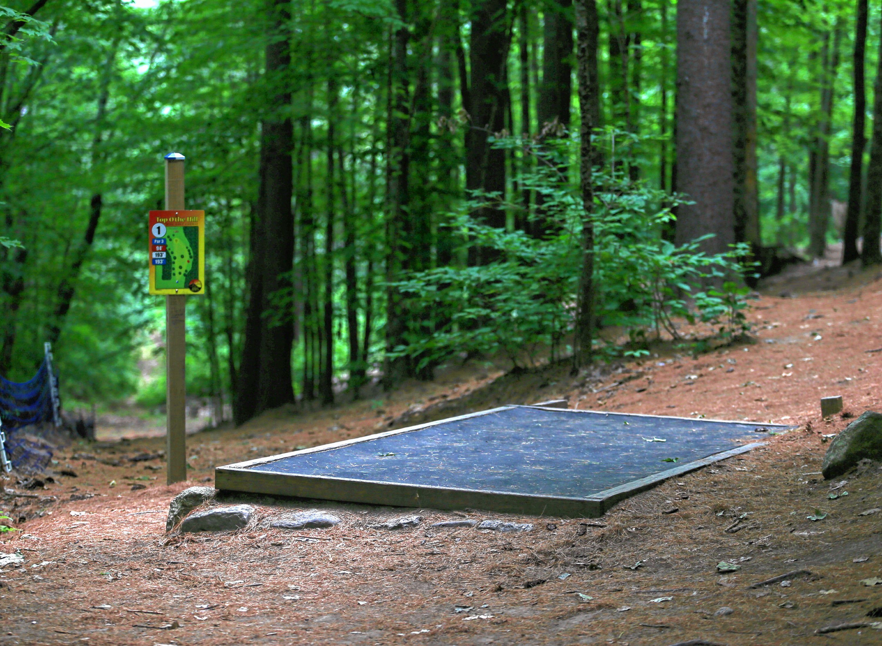 If you make your way through the woods at Top O’The Hill Disc Golf Course in Canterbury, you’ll quickly come across the first tee box.