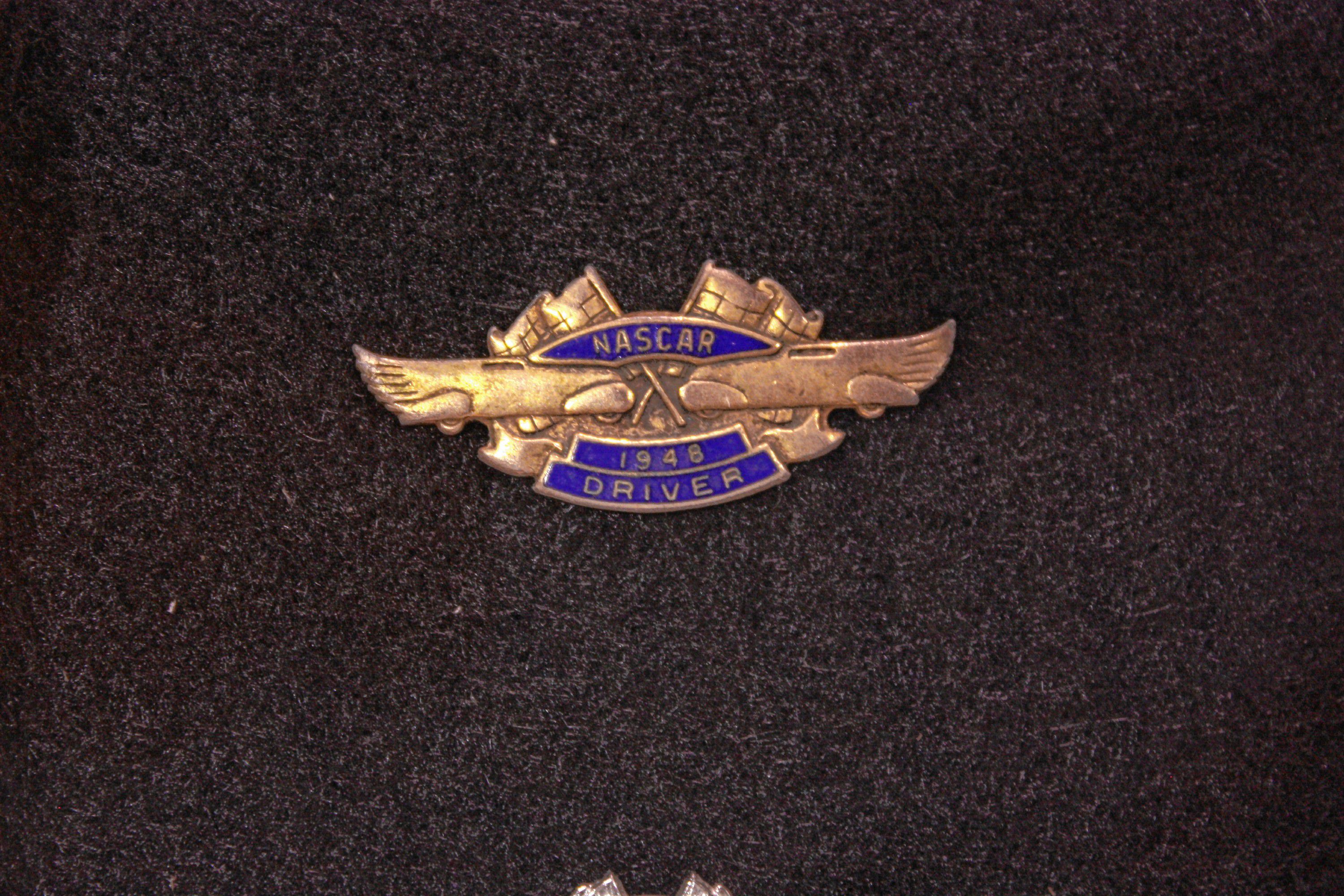 This is a Nascar driver pin from 1948, the very first year of Nascar races. It's hard to know for sure, but this may be the only remaining 1948 Nascar driver's pin in existence.  JON BODELL / Insider staff