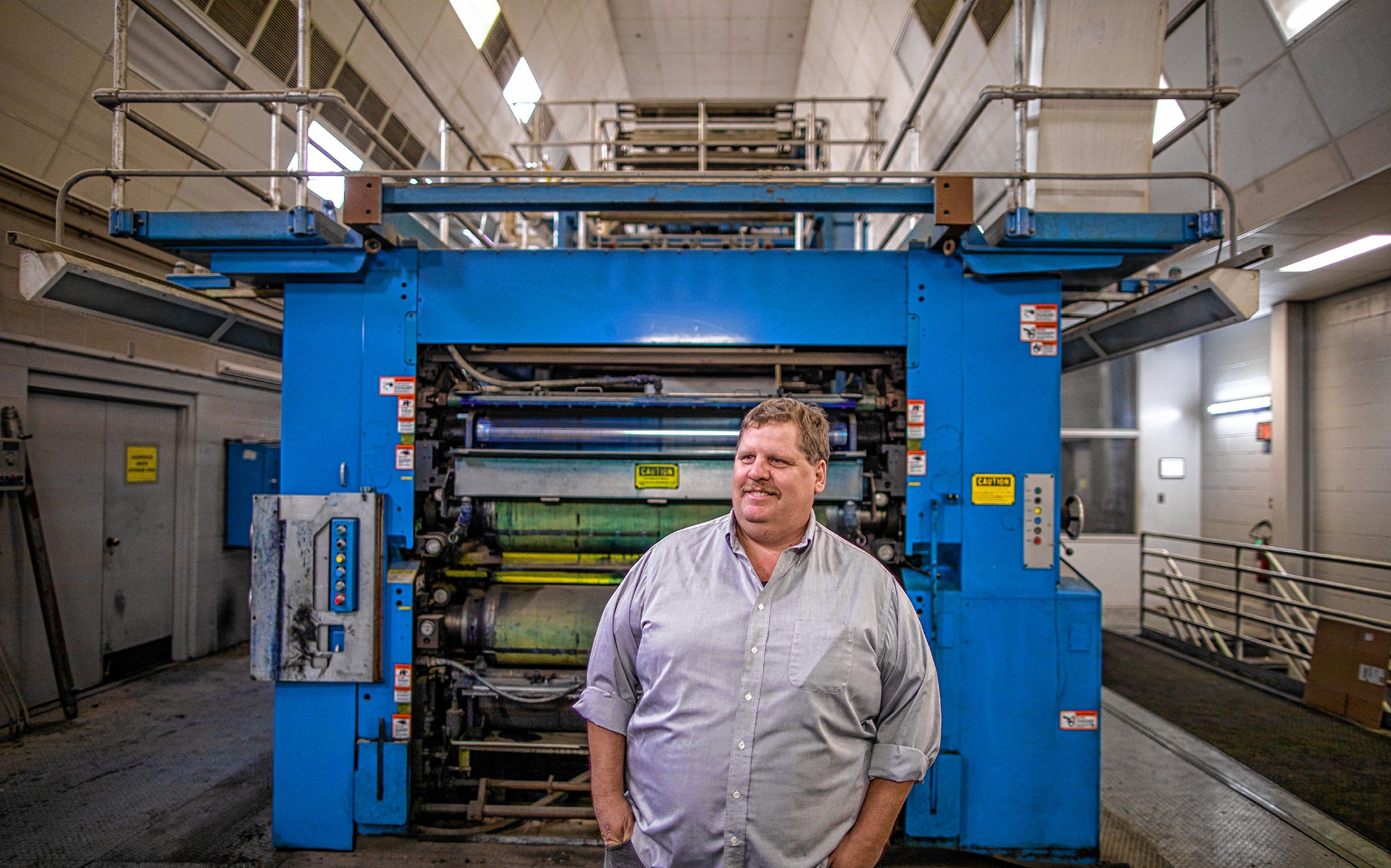 Harry Green in front of the Flexo press in the Concord Monitor building that started printing the 'Monitor' in 1990. GEOFF FORESTER