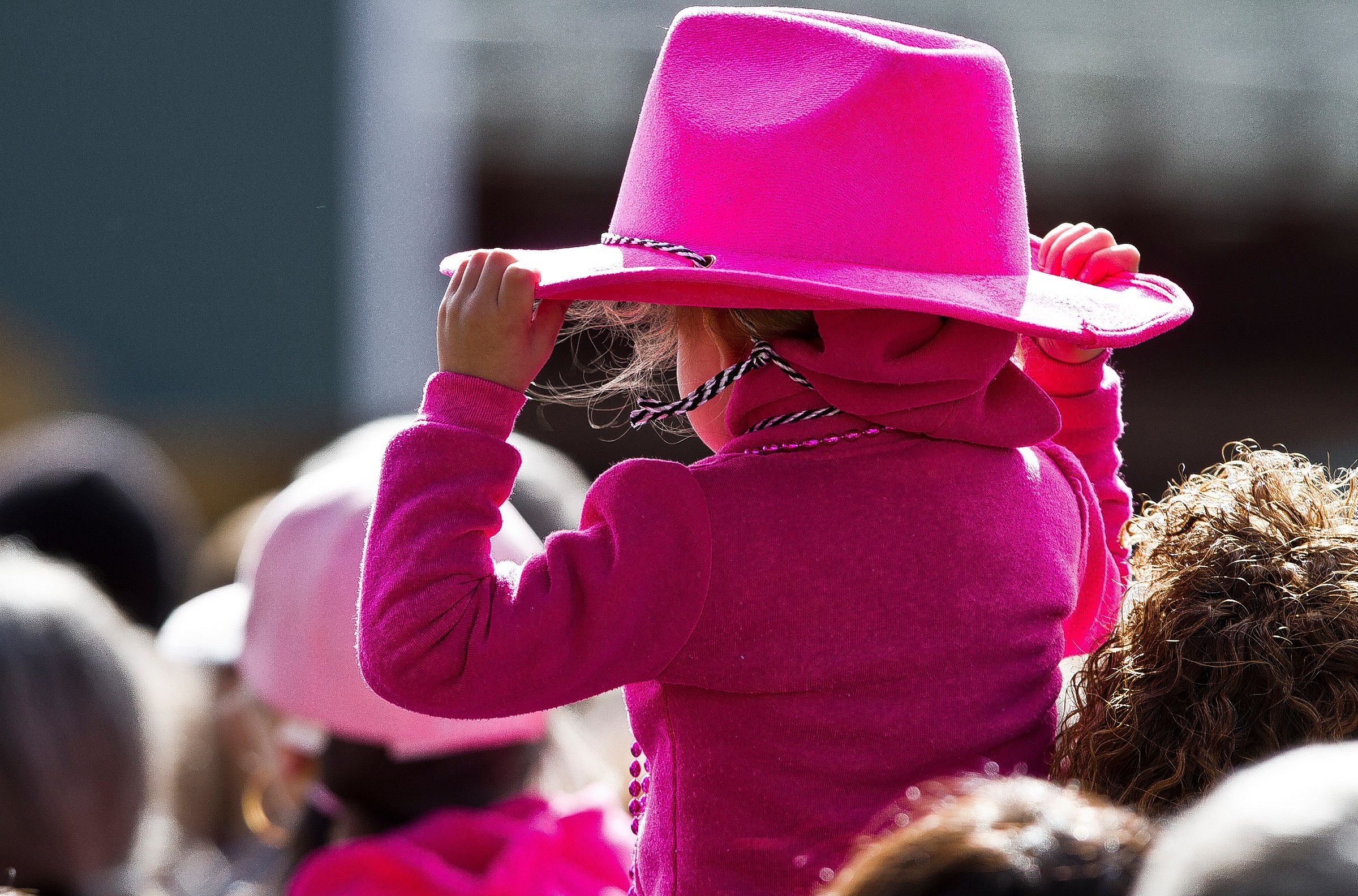 A young girl dones all pink at the Making Strides against Breast Cancer Walk at Memorial Field Sunday. (GEOFF FORESTER / Monitor staff 