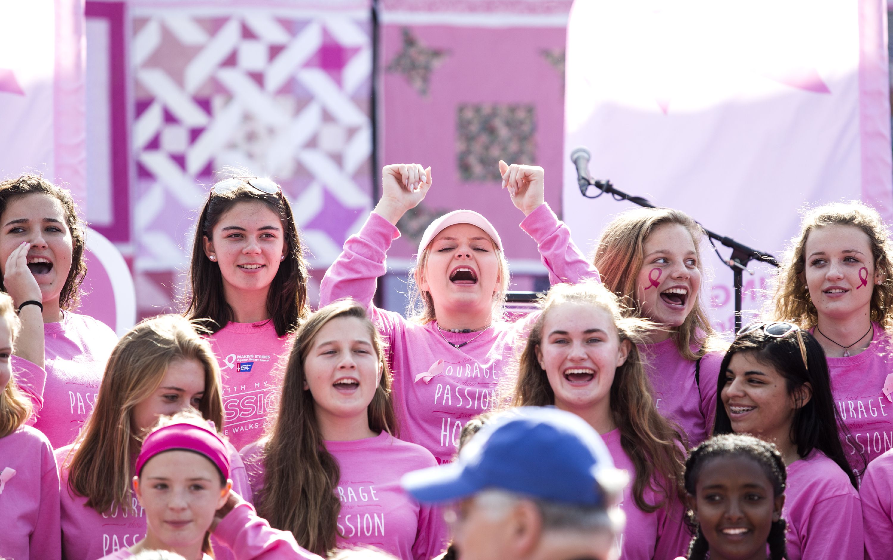 Coe Brown Northwood soccer captain Kiley St. Francis (center with arms raised) leads her team as Michael St Germain of Concord Photo Service gets ready to take the Making Strides Against Breast Cancer team photo on Sunday October 15, 2017 at Memorial field. GEOFF FORESTER