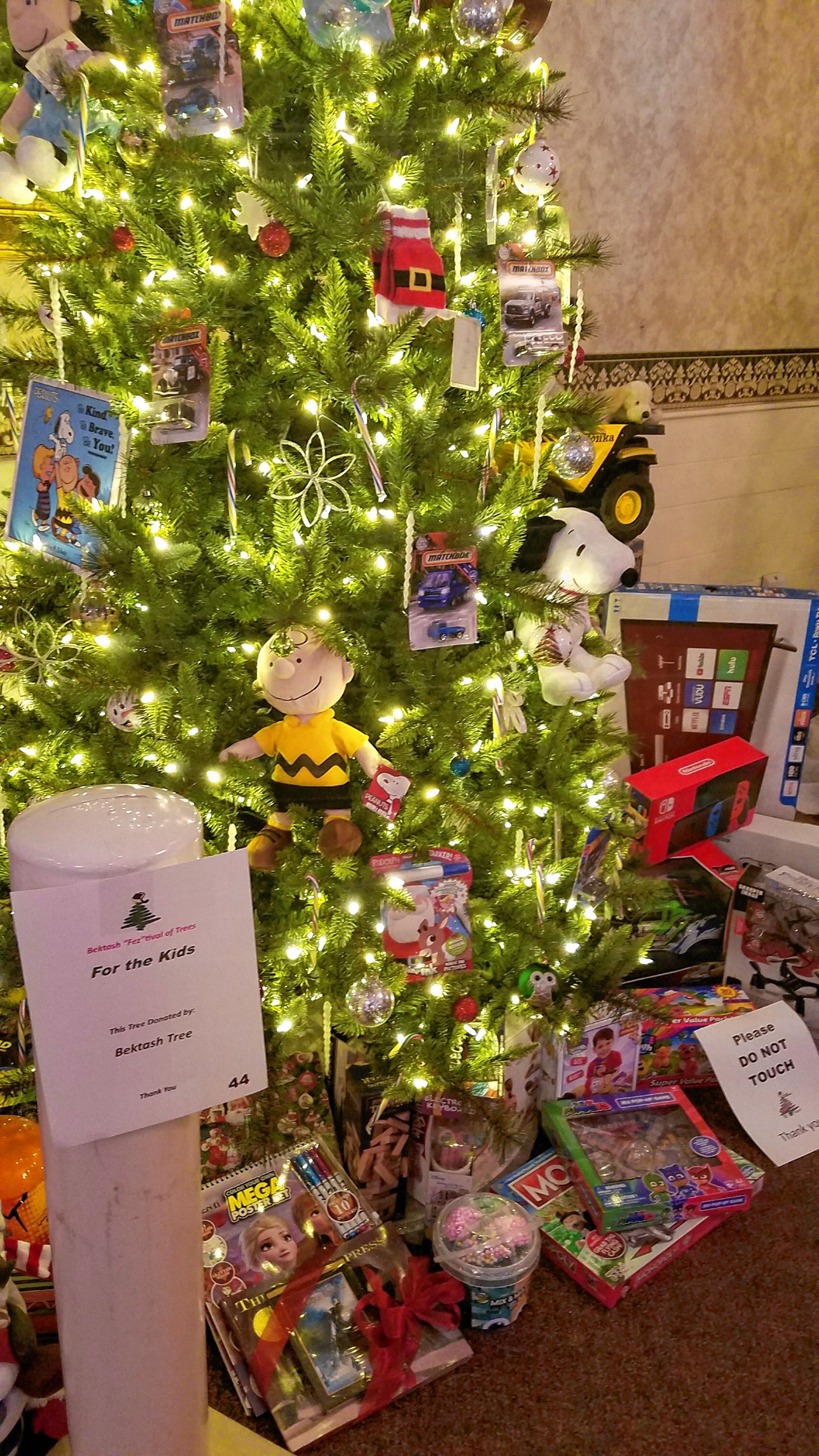 This "For the Kids" tree, donated by Bektash Tree, features a slew of high-end toys and gadgets including a Nintendo Switch, an Xbox One, a TV, a drone and much more. JON BODELL / Insider staff