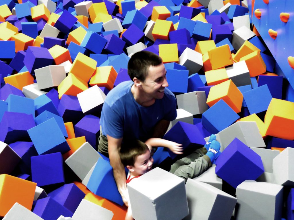 Ronnie Palmer plays with his son, Ronnie, in a foam pit at Altitude Trampoline Park in Concord's Steeplegate Mall on November 21, 2018. Caitlin Andrews
