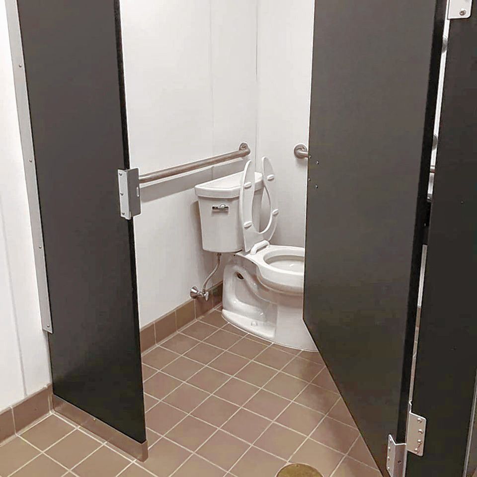 After renovations, there are new stall dividers, toilets, tile and sinks in the Bicentennial Square restrooms.