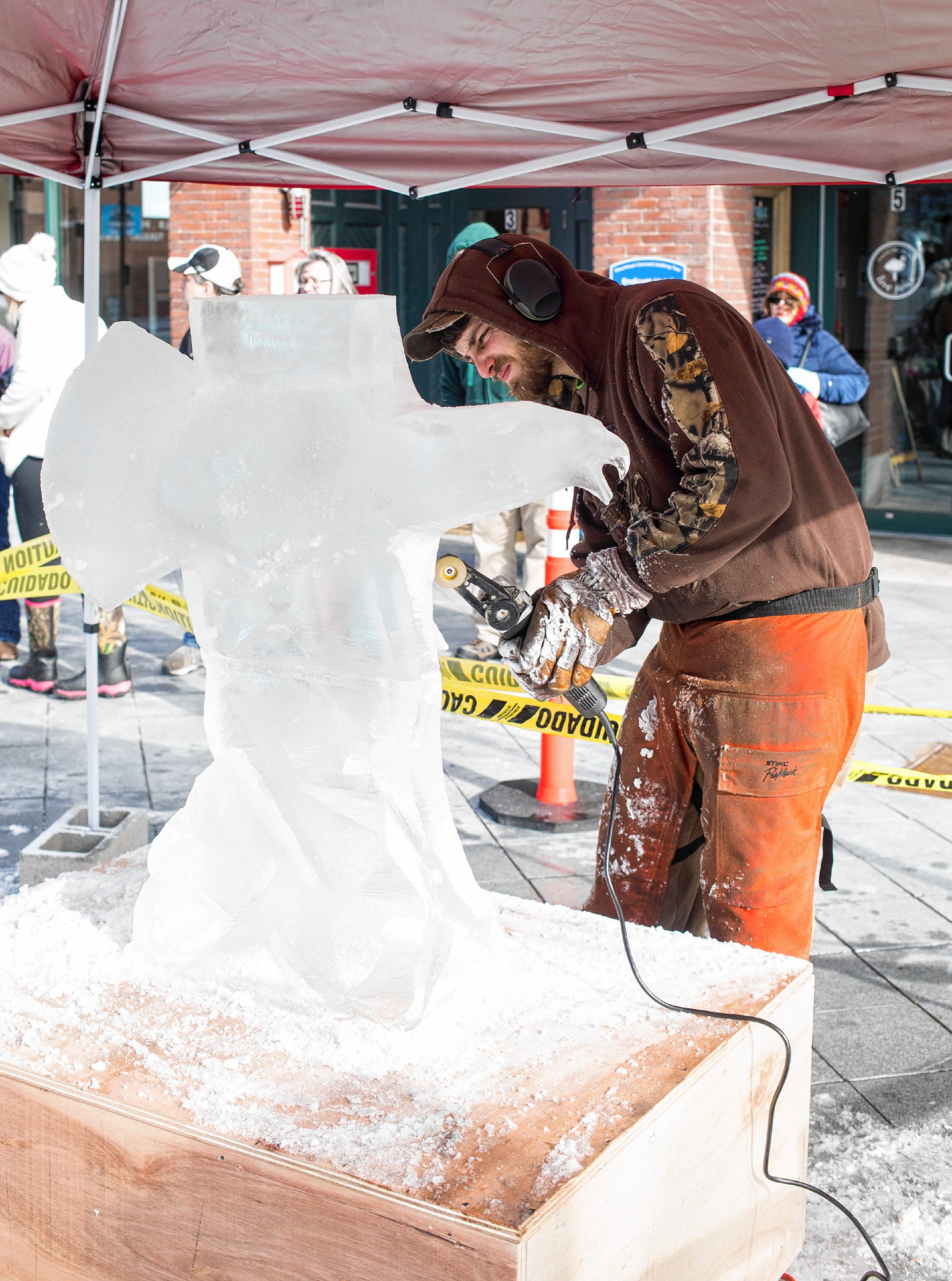 Michael Legassey of Athol, Mass., works on a bald eagle ice sculpture in downtown Concord on Saturday, January 26, 2019. "I mainly work with wood but ice has given me a chance to experiment in a different medium," Legassy said.  