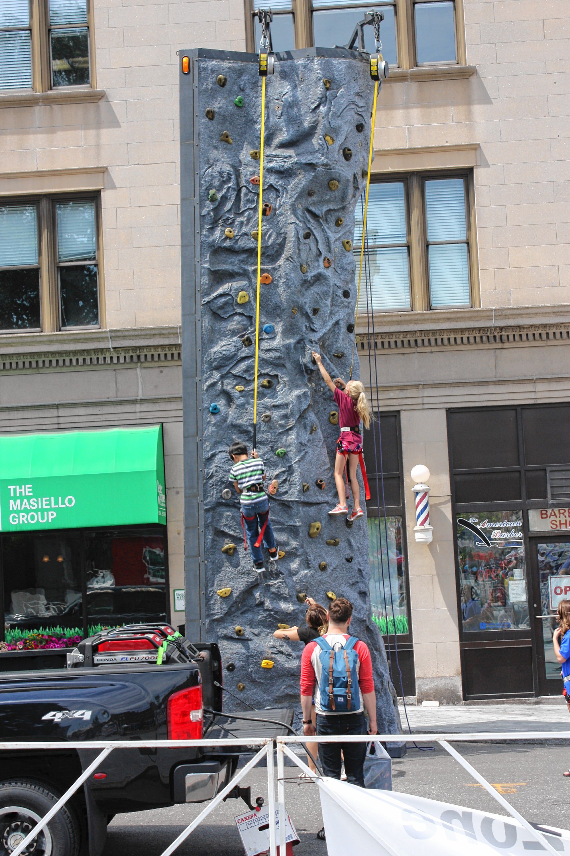 The rock climbing wall provided by Evo Rock + Fitness was quite a hit with the kids during Market Days. 