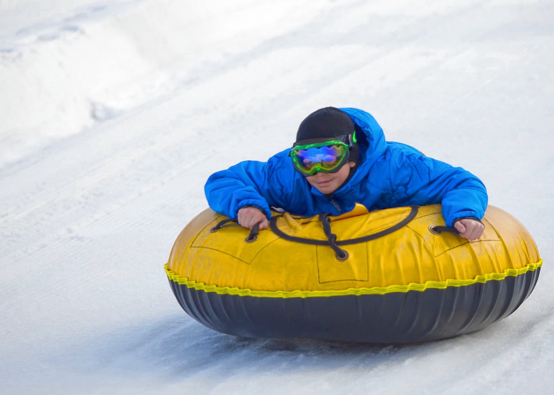 Students sled down a hill at White Park in Concord on Tuesday, Dec. 12, 2017. Luce, who attends Christa McAuliffe School, had a snow day and walked to the park with her mother. (ELIZABETH FRANTZ / Monitor staff)