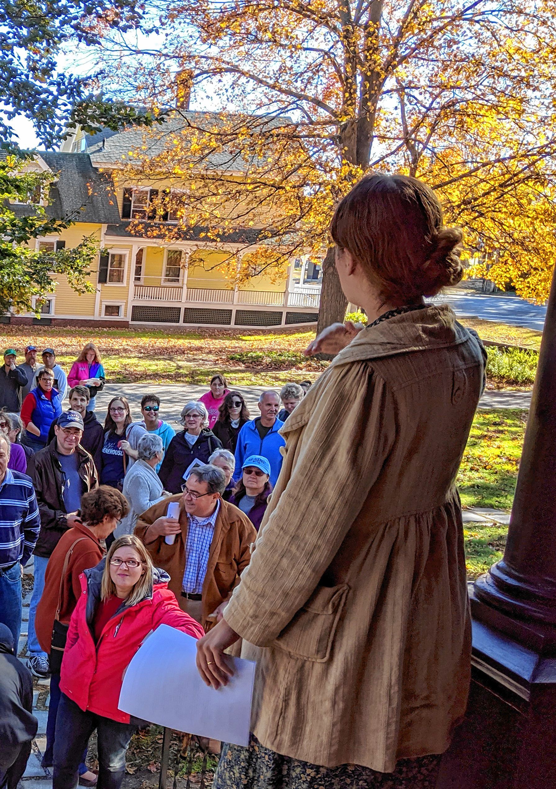 Ruth Richardson, appearing as Louise Kimball Jenkins, leads a tour of the mansion and school of art.  