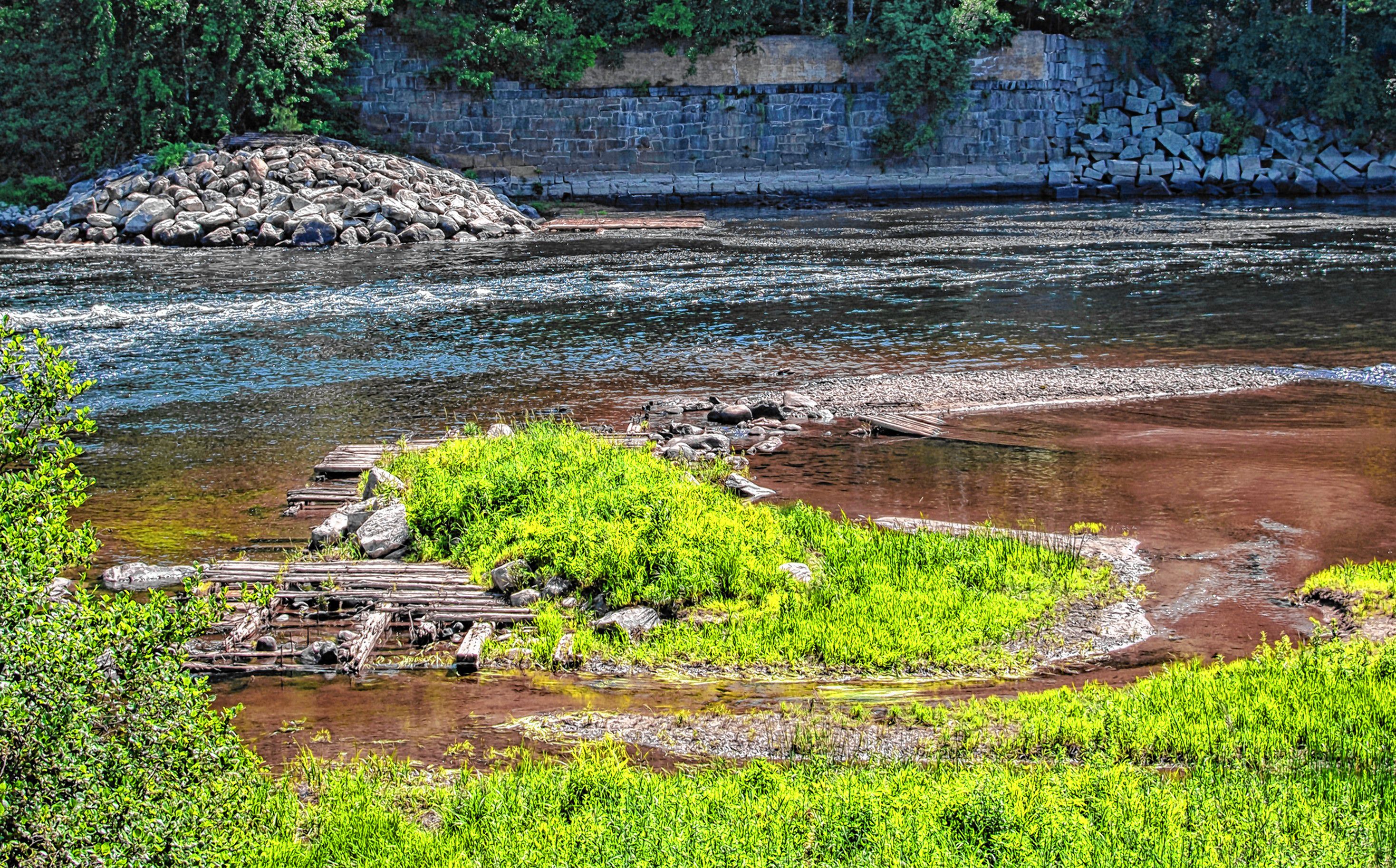 Remains of the Sewalls Falls Dam are scattered around what is now the Sewalls Falls Multi-Use Recreation Area. 