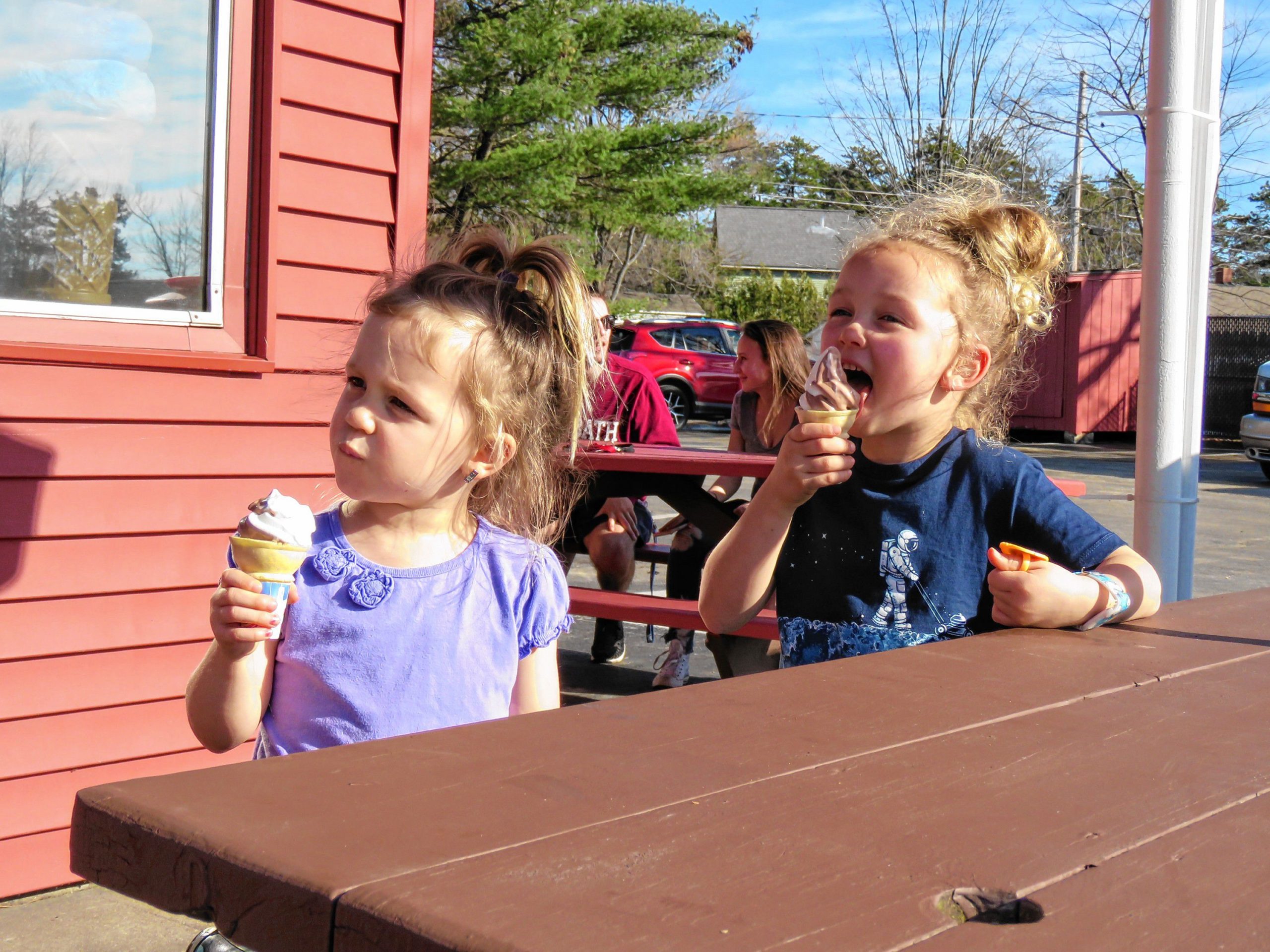 Adeline (left, 3) and Ella (5) Lundquist of Hopkinton eat a chocolate-vanilla twist ice cream cone at Arnie's Place on Wednesday, Feb. 21, 2018. 