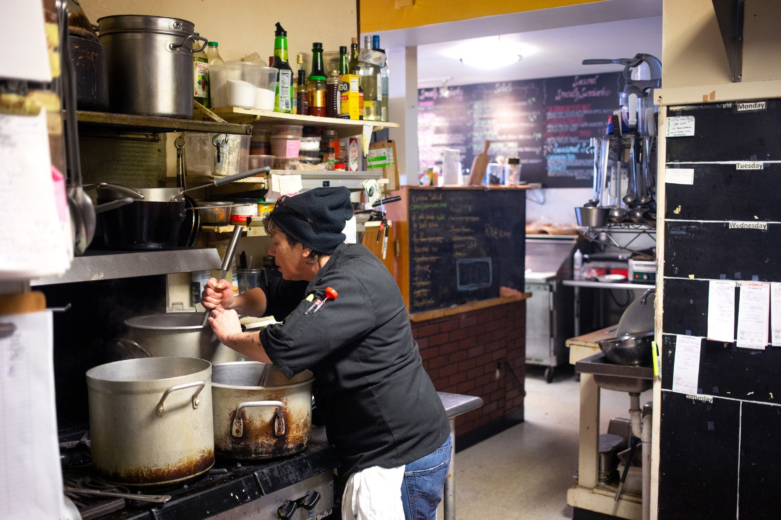 Catering chef Rachel Robie works in the kitchen at the Washington Street Cafe on Tuesday, February 18, 2020. GEOFF FORESTER