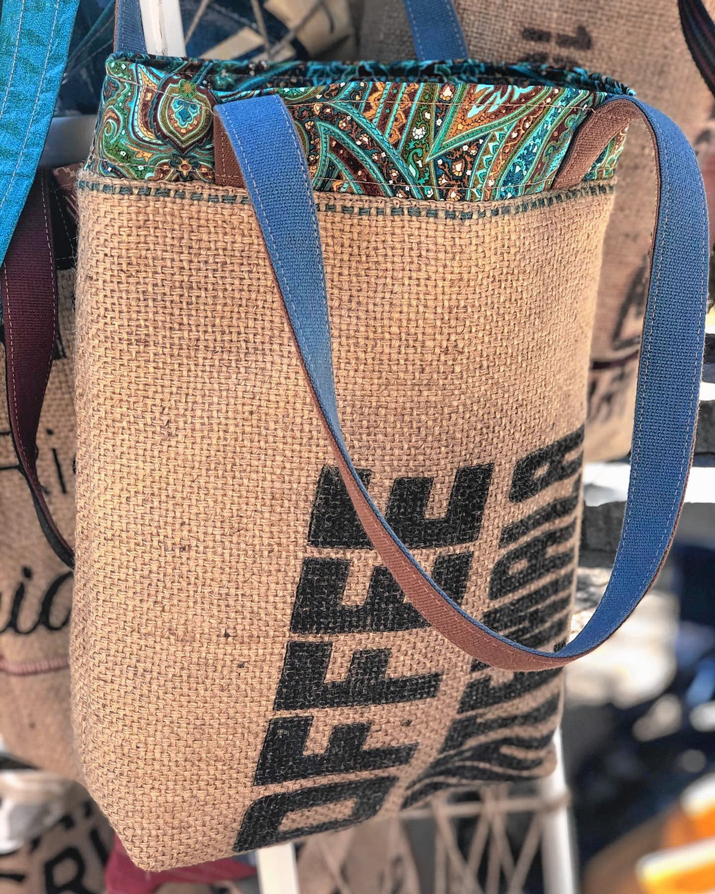 New World Designs upcycles coffee sacks and billboards into unique bags. 