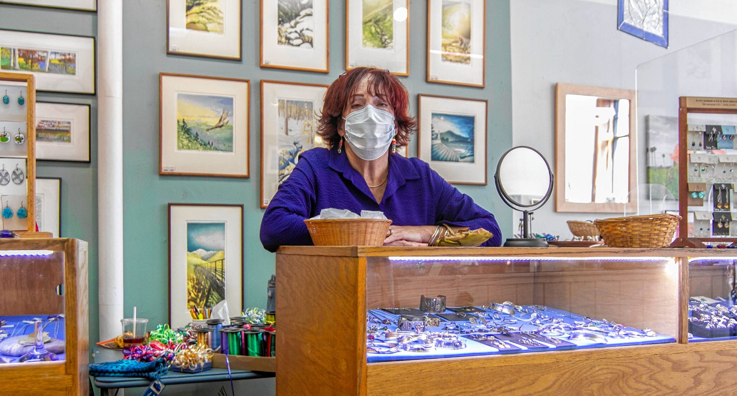 Employee Su Egan behind the counter at the League of NH Craftsman located in Downtown Concord on Main Street October 1st, 2020. ALLIE ST PETER