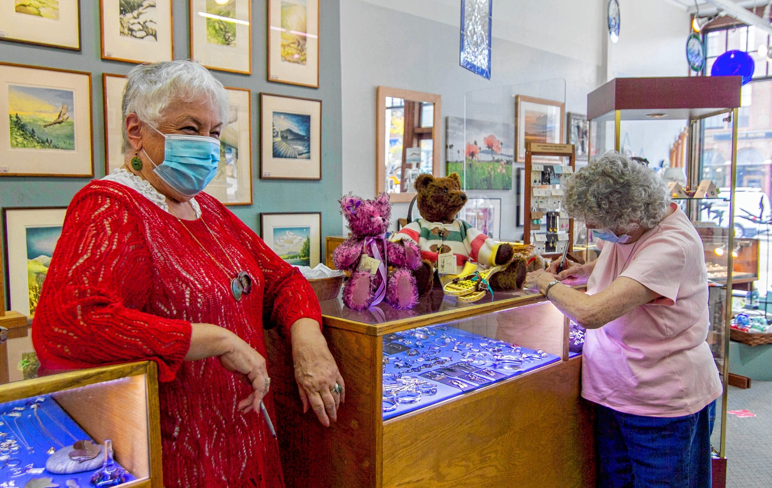 Employee Penny Verville (left) and crafter Diana Lynd (right) at the counter of  League of NH Craftsman located in Downtown Concord on Main Street October 1st, 2020. ALLIE ST PETER