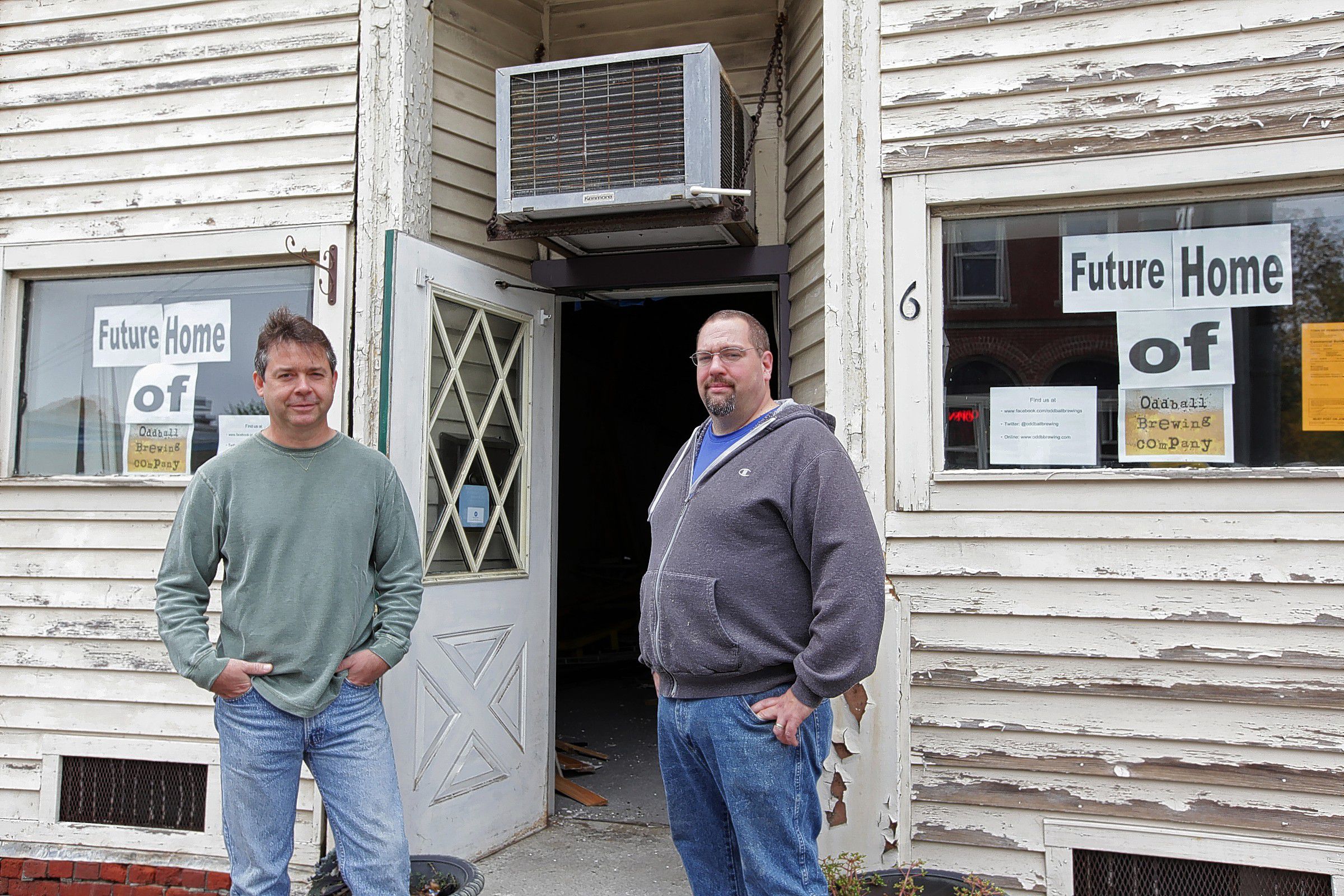 Mark Ferguson (left) and Bill Walden stand in front of the future home of Oddball Brewing Co., at 6 Glass St., Pembroke on Saturday, Oct. 18, 2014.  (SUSAN DOUCET / Monitor staff) Mark Ferguson (left) and Bill Walden stand in front of the future home of Oddball Brewing Co. on Saturday. 