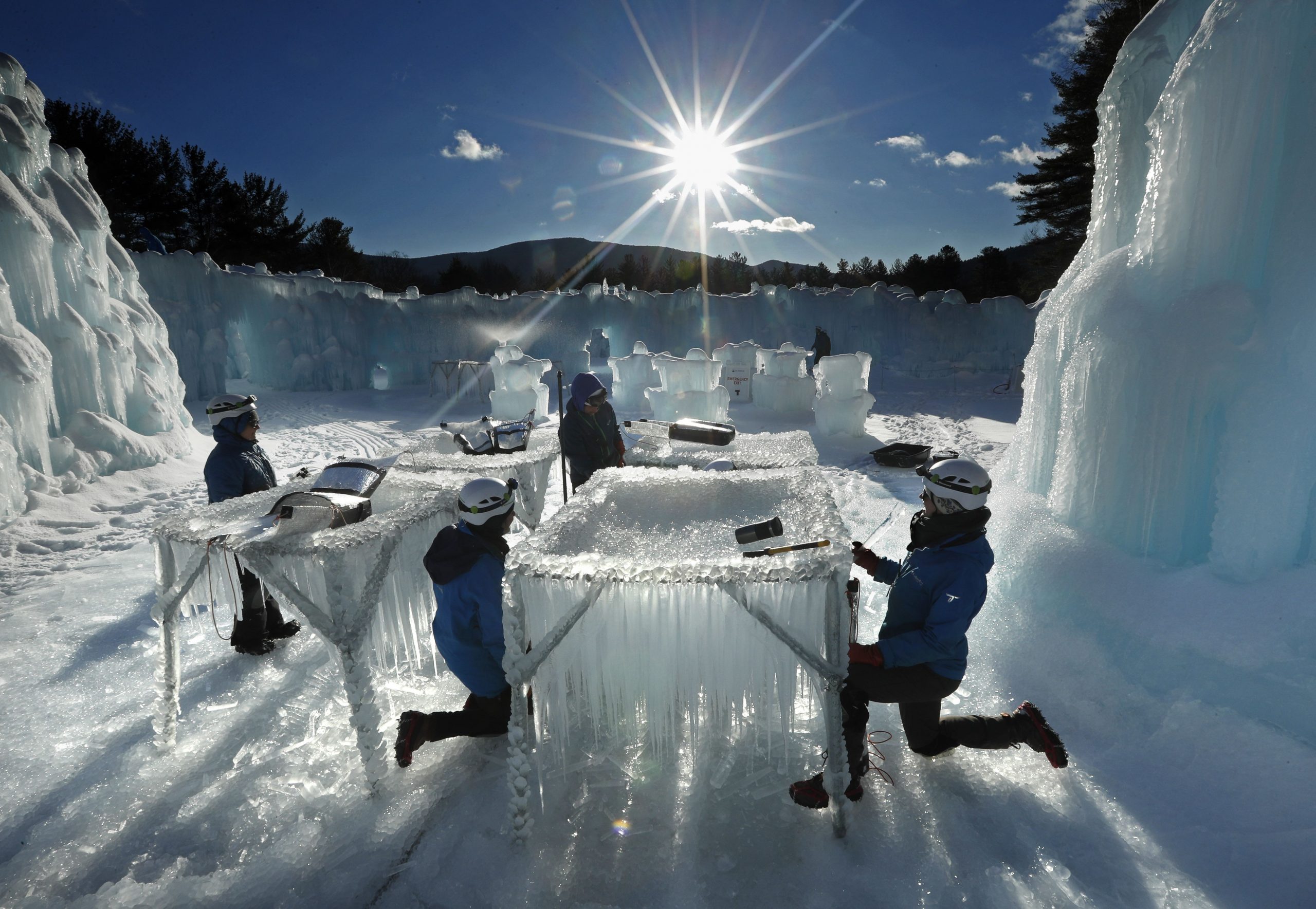 In this Monday, Jan. 28, 2019 photo, icicles are harvested for use in growing the walls at Ice Castles in North Woodstock, N.H. The winter wonderland is one of six in North America. (AP Photo/Robert F. Bukaty)  Robert F. Bukaty