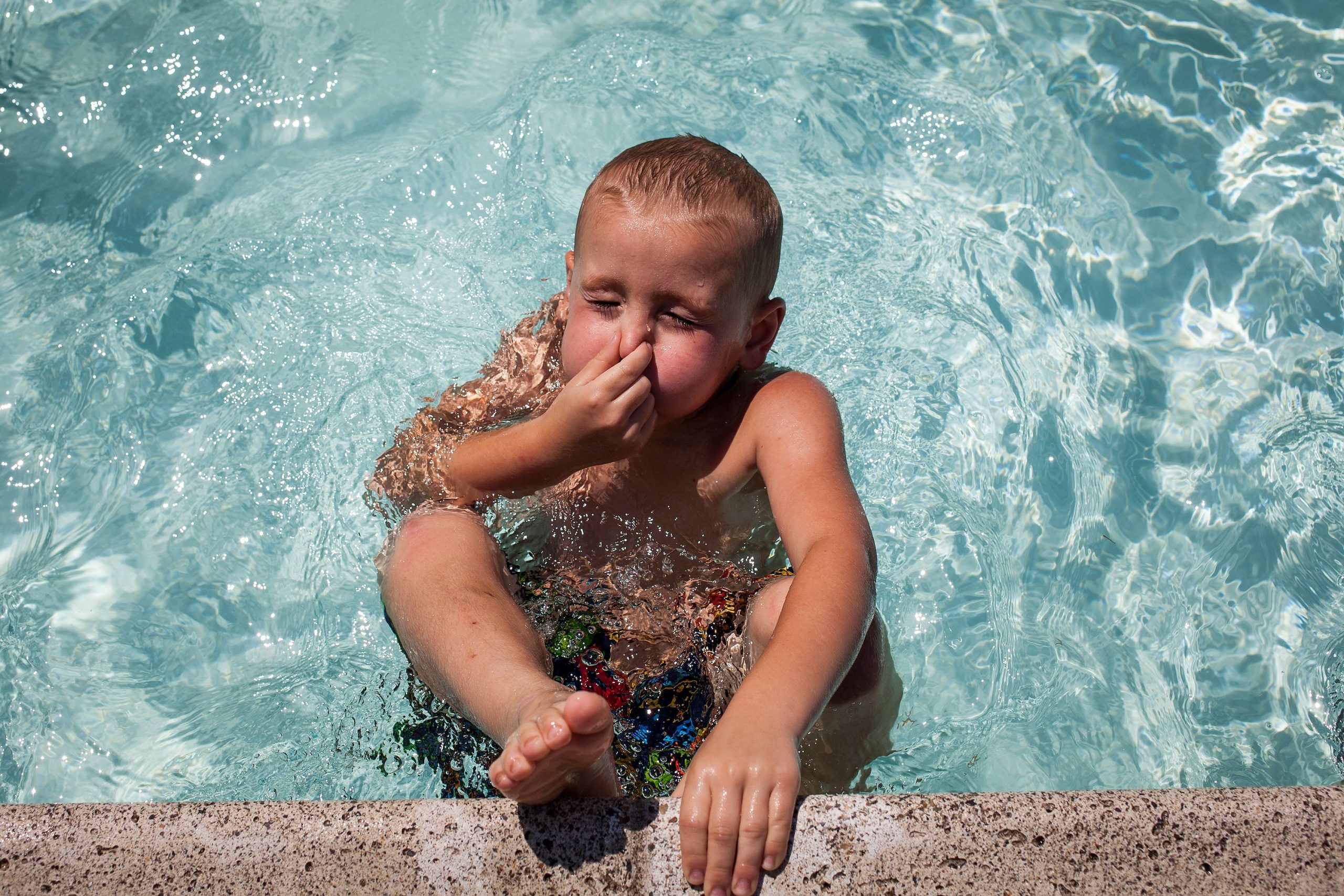 Five-year-old Jason Doucette of Concord takes a deep breathe before pushing off the edge of the Concord city pool in White Park on Tuesday, August 1, 2017. (ELIZABETH FRANTZ / Monitor staff) ELIZABETH FRANTZ