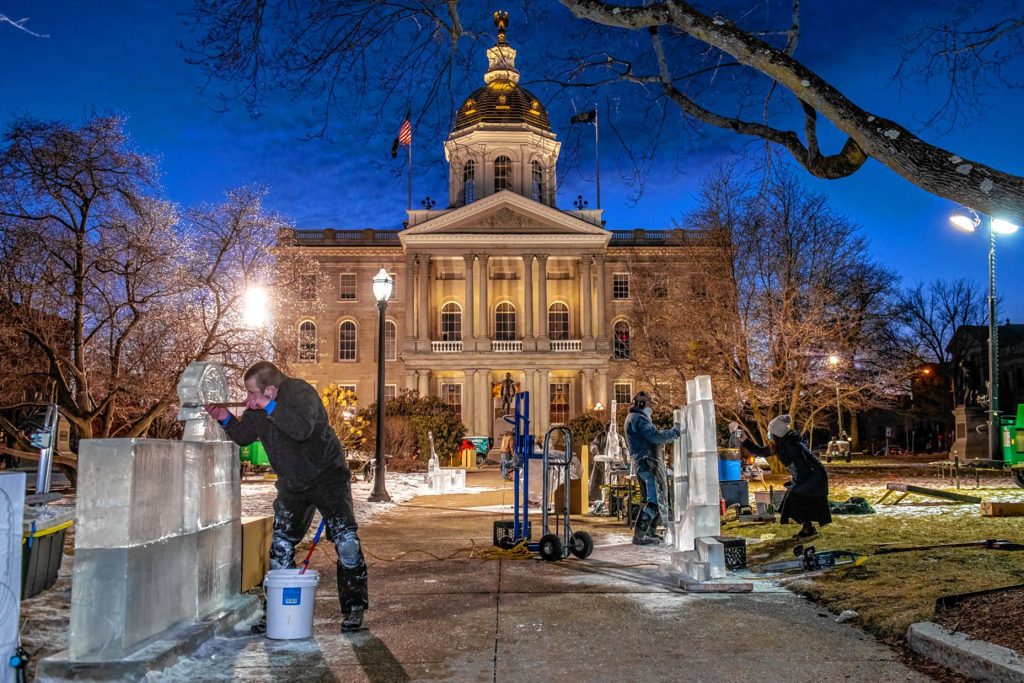 Ice sculptors work on their carvings during previous Winter Fest celebrations. 