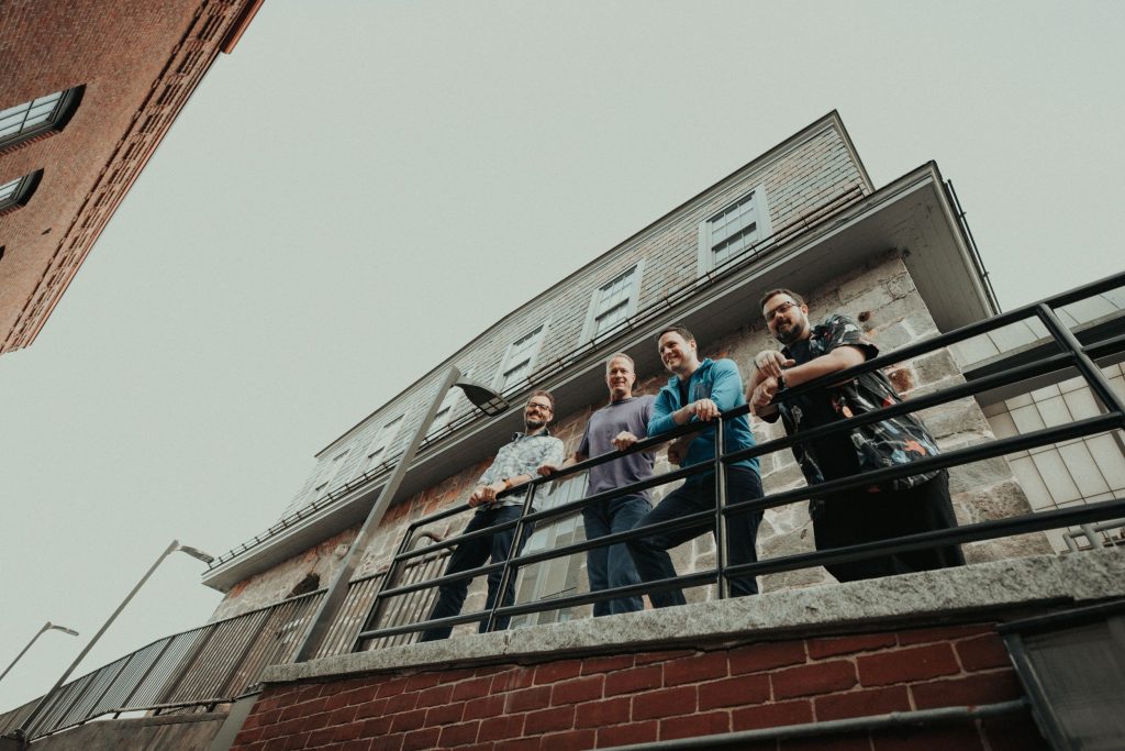 Andrew North, Dale Grant, Chip Spangler, and Rob O’Brien ready to share their album.