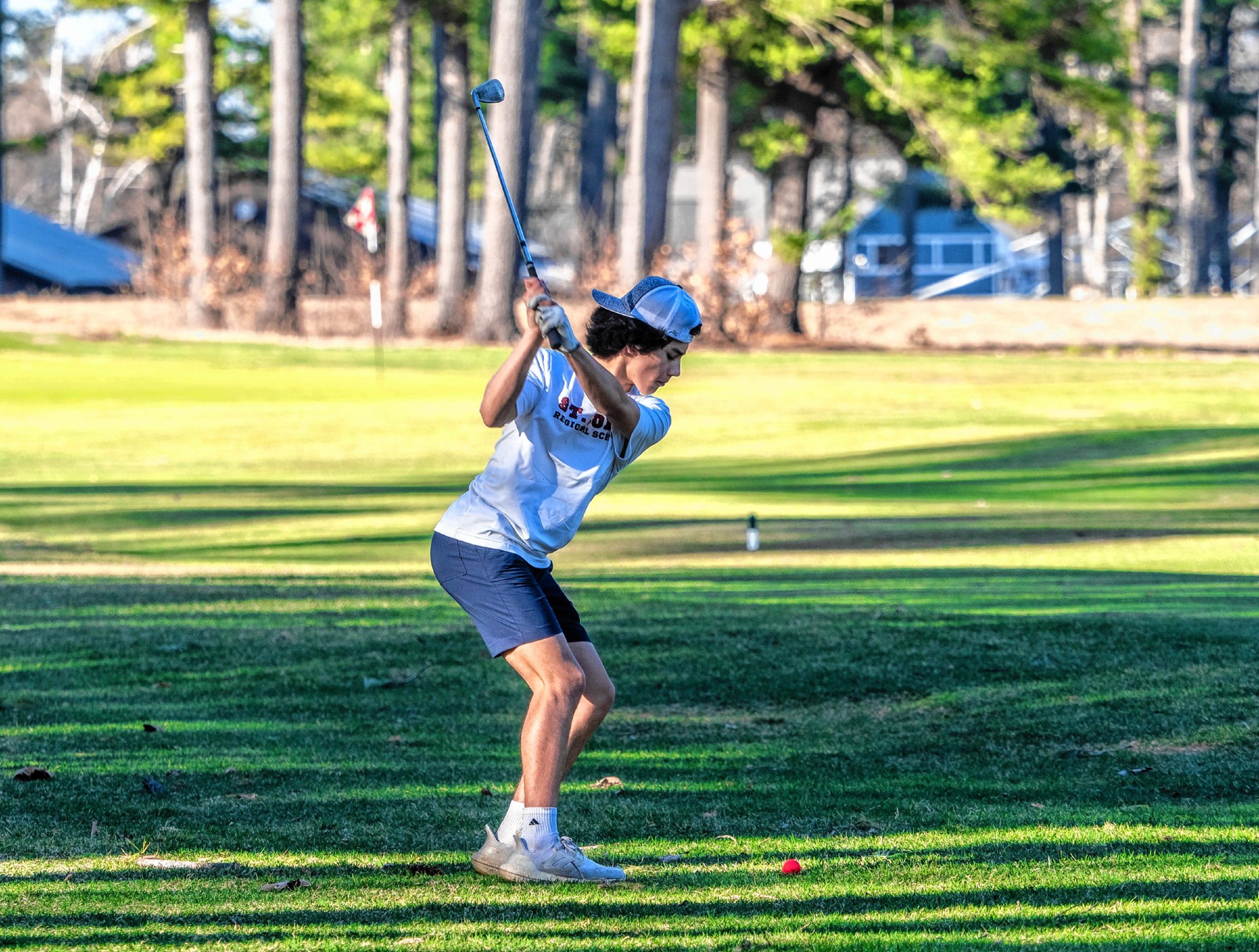 Cam Fortier hits an approach shot at the 5th hole at Beaver Meadow Golf Course on Thursday afternoon, April 13, 2023. Fortier was playing with his St. Johnâs School classmates in a scramble game. The high temperatures are coming to an end this weekend as the 80s of the last couple of days, returns to normal temperatures in the 50s over the weekend. GEOFF FORESTER