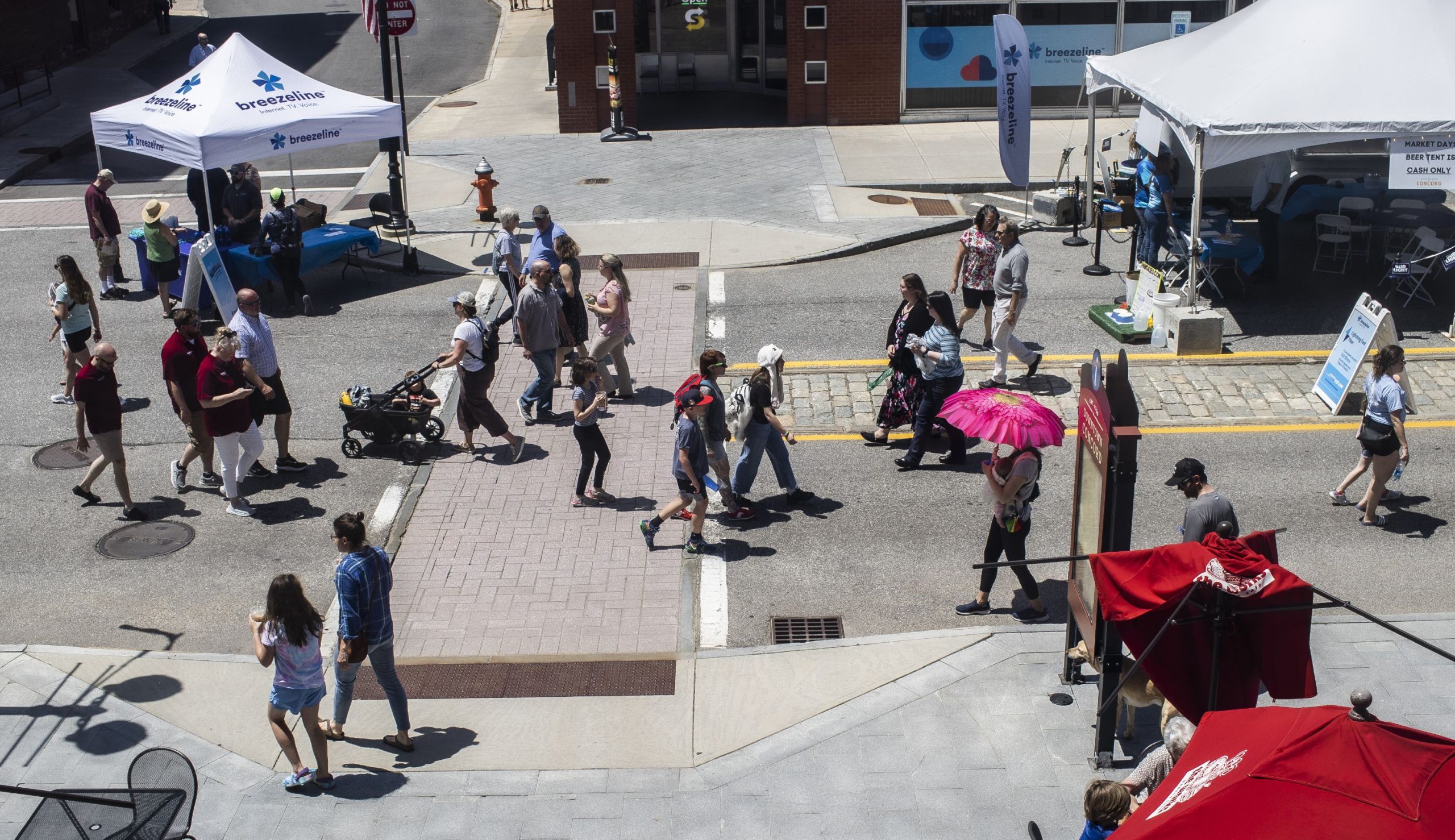 People walk up and down North Main Street in Concord on the first day of Market Days on Thursday, June 22, 2023.  GEOFF FORESTER