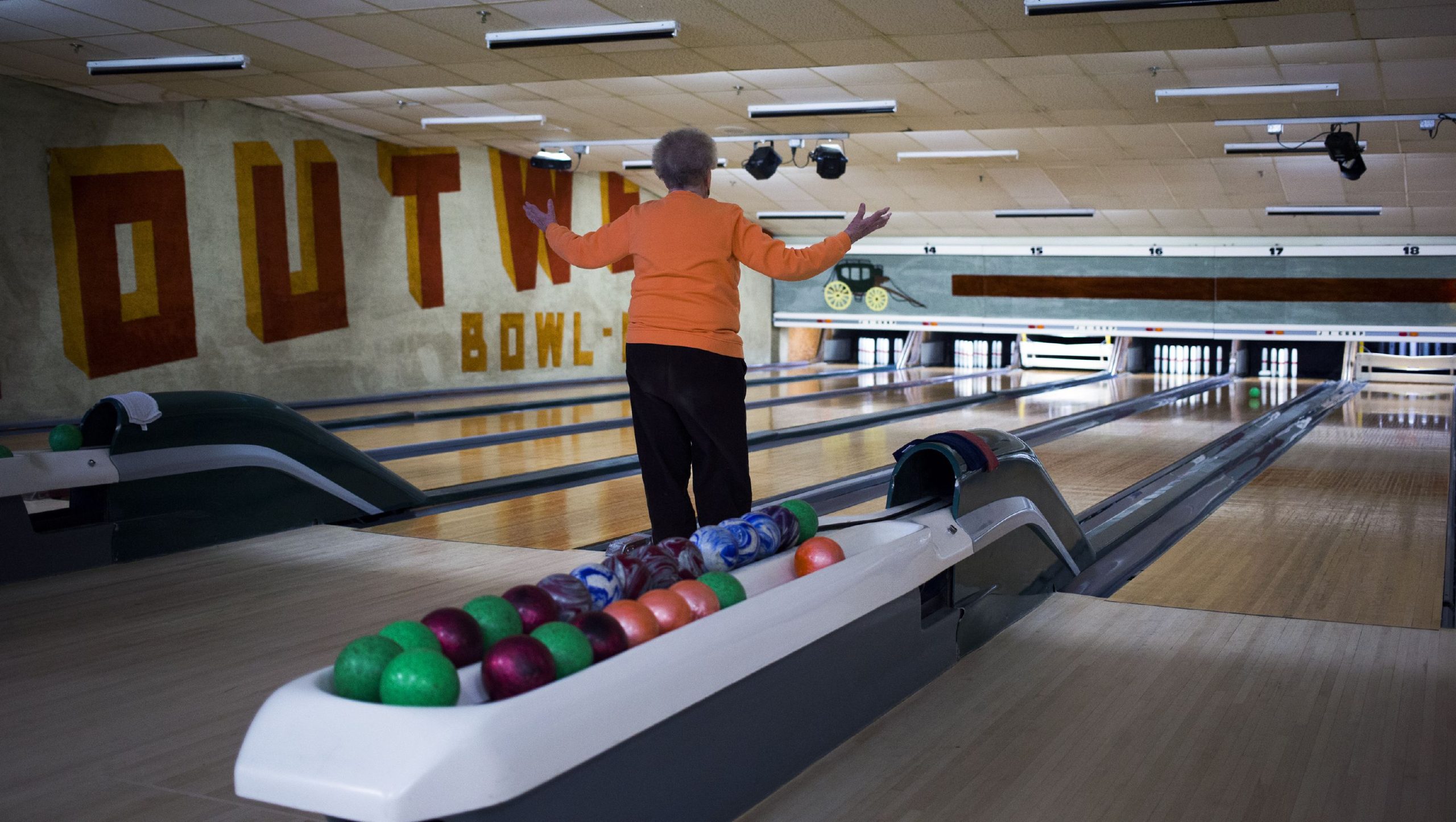 Alice Coleman watches as her bowl nears the candlepins at Boutwells Bowling Center in Concord on January 31, 2018. GEOFF FORESTER