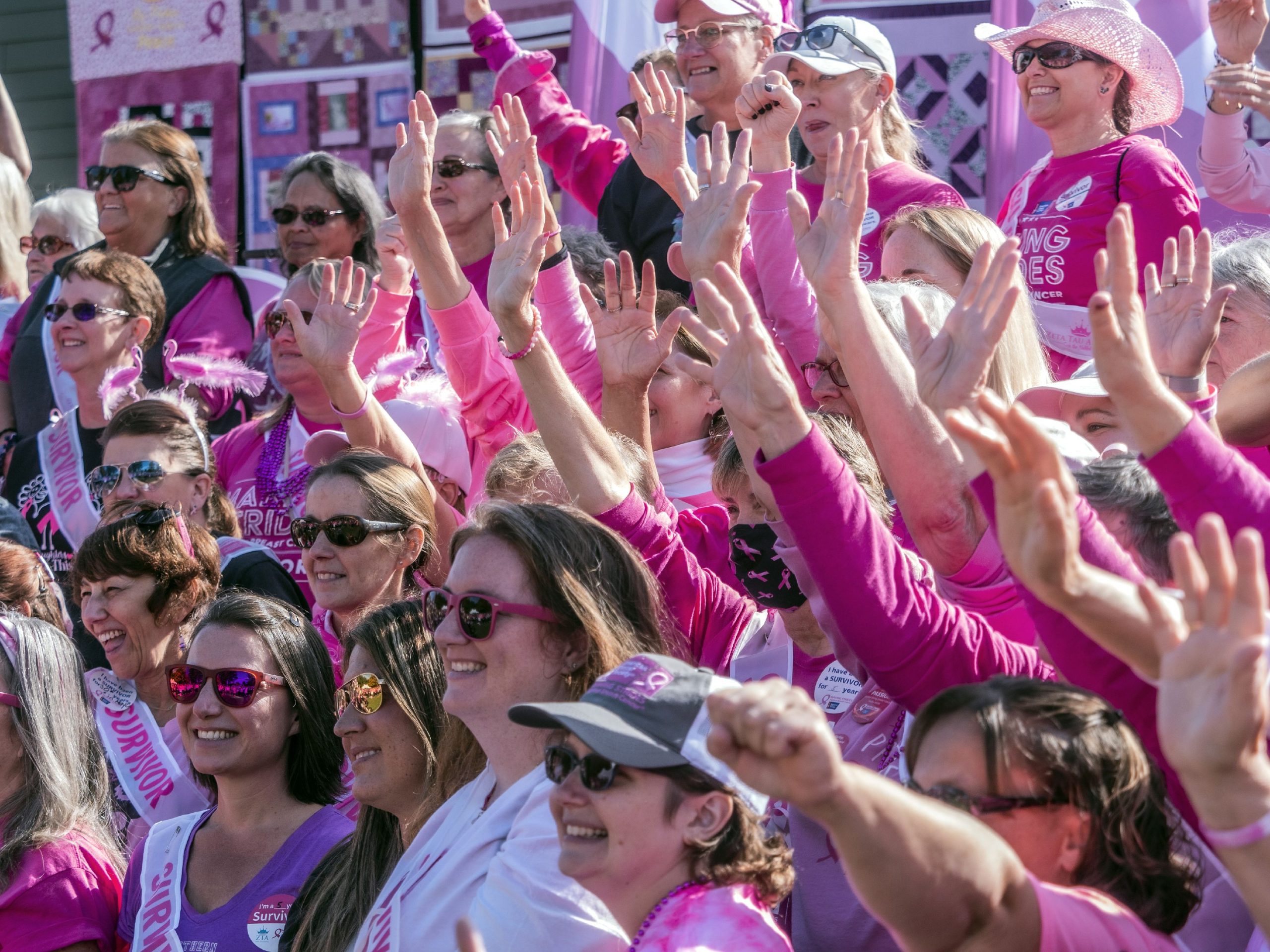 Breast Cancer survivors acknowledge the crowd up on the stage at the 30th annual Making Strides Against Breast Cancer Walk at Memorial Field on Sunday, October 15, 2022. 