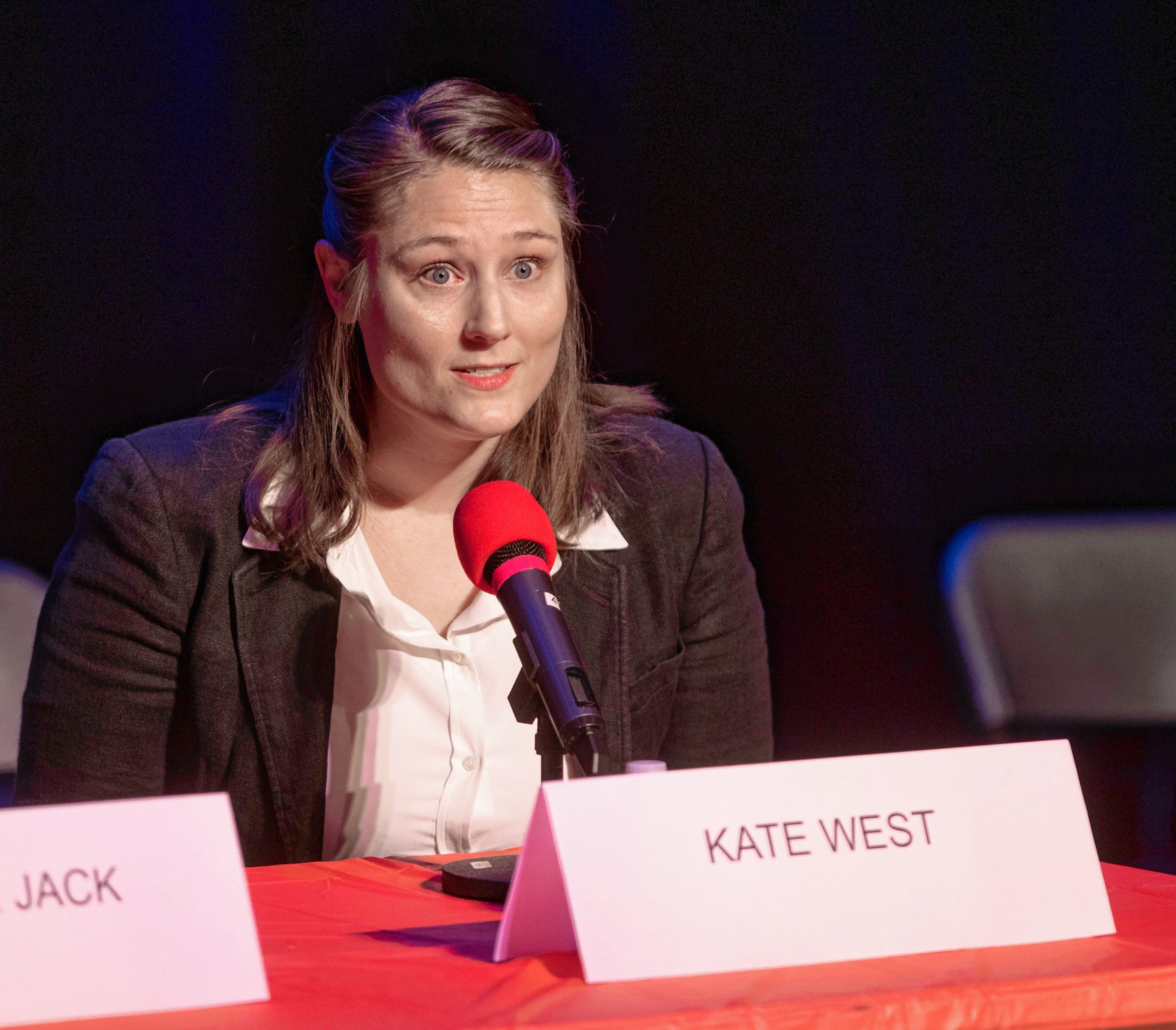 Kate West talks about her experiences about being unhoused with a child at the Mayoral Candidate Forum at Concord High School on Tuesday, October 24, 2023. GEOFF FORESTER