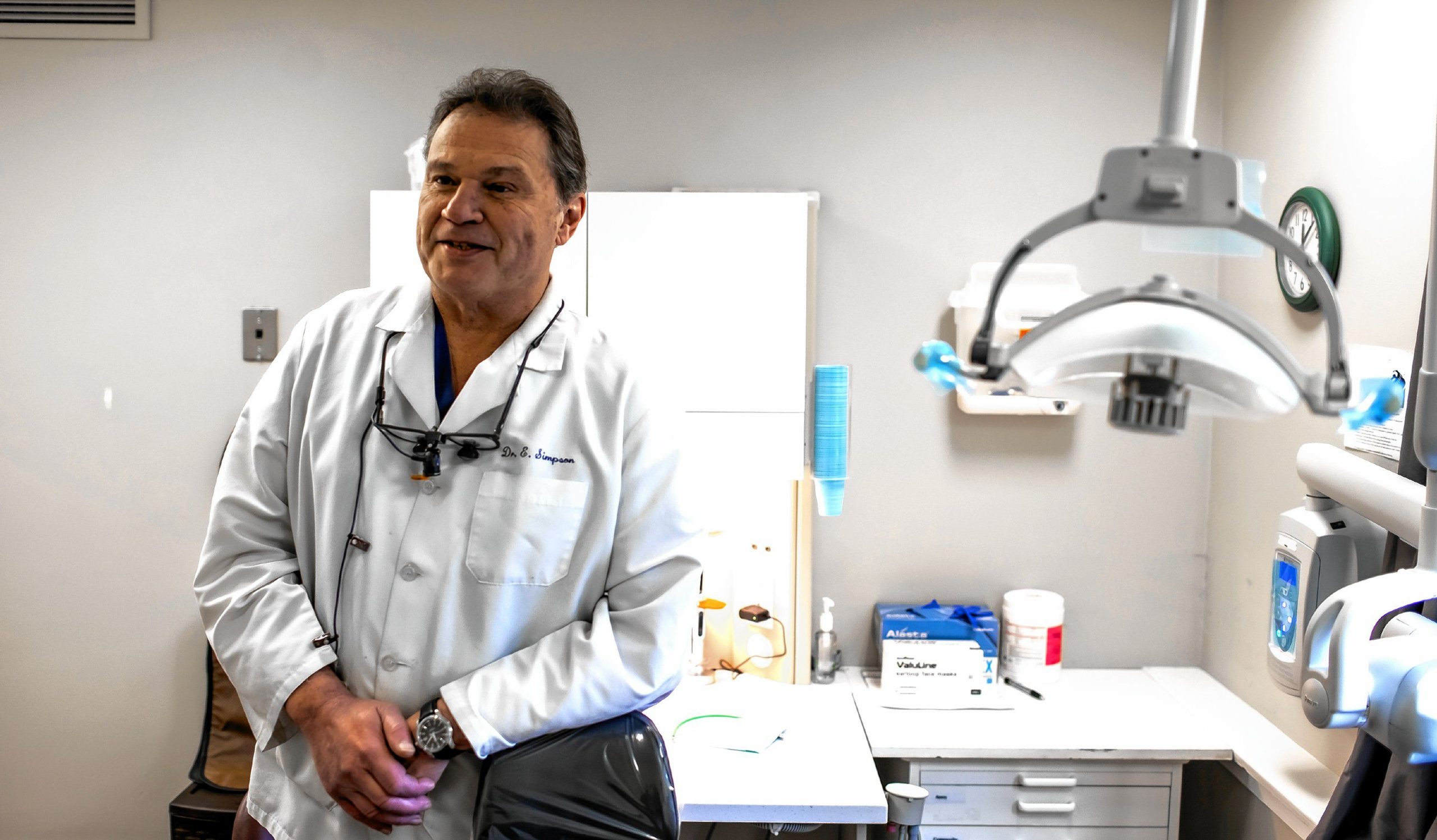 Dr. Earle Simpson at his Saving Peopleâs Smiles dental office on Pleasant Street on Tuesday, December 19, 2023. Saving Peopleâs Smiles is a stark difference from the private practice Simpson ran for nearly four decades in Bedford. GEOFF FORESTER