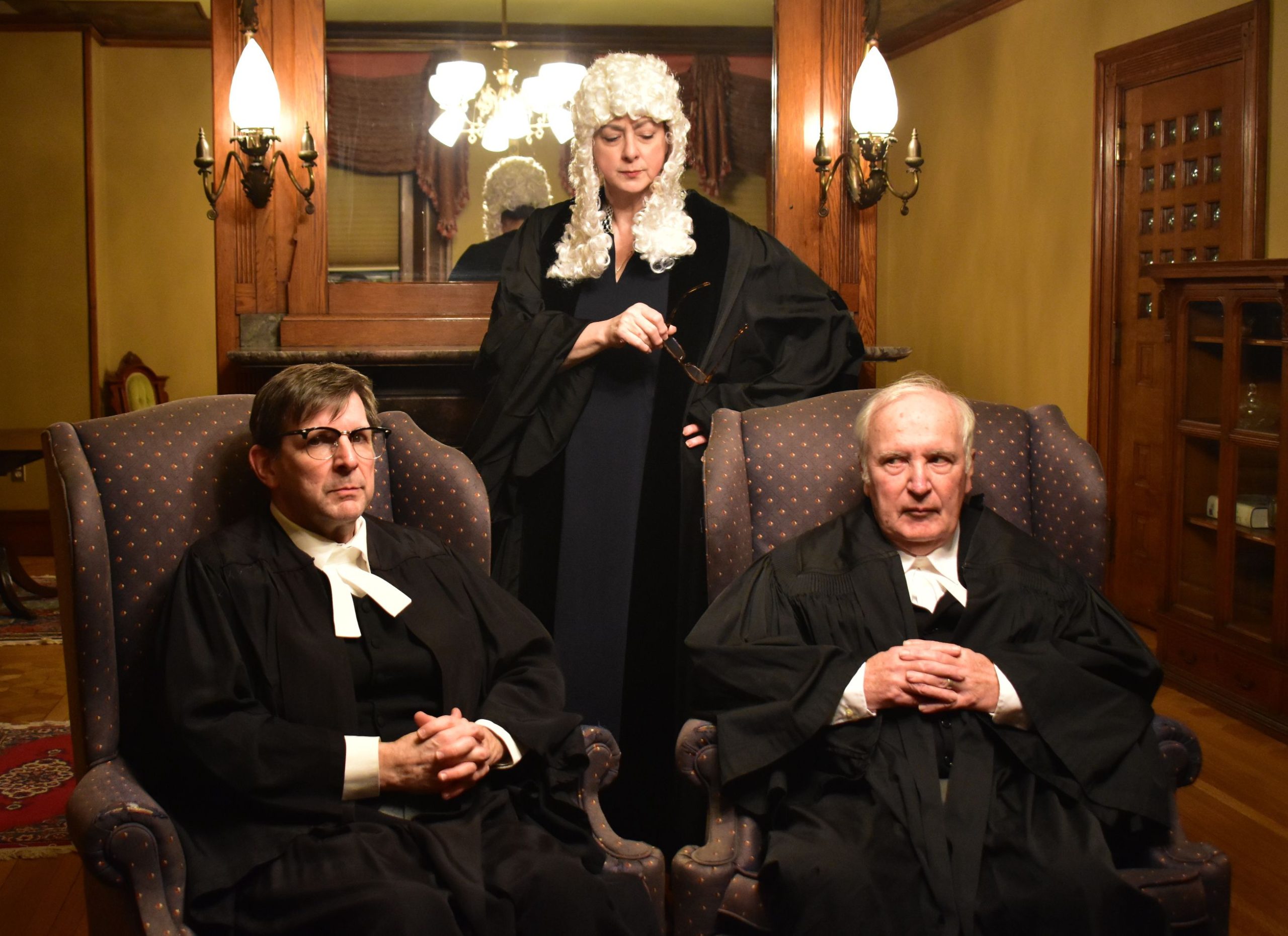 Chris Connell and John Conlon (from left) play sparring barristers for prosecution and defense in Agatha Christie’s “Witness for the Prosecution,” Feb. 16-18 at Concord City Auditorium. Valerie Kehr (standing) casts a jaundiced eye on the proceedings in the role of Justice Wainwright.